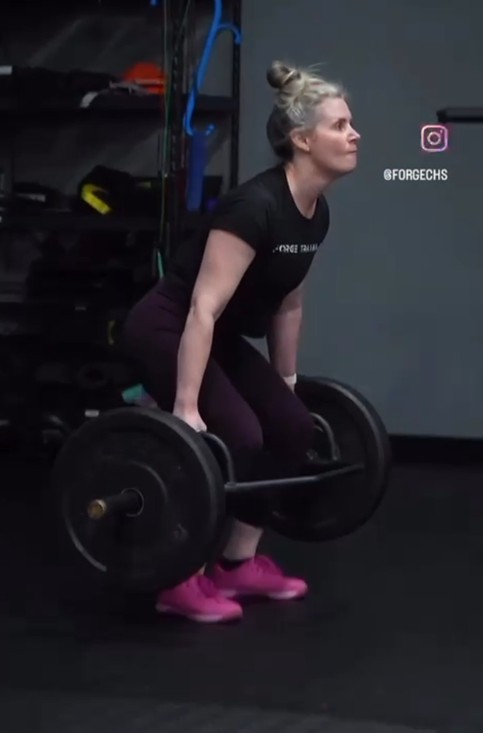 Woman strength training with barbell at Forge CHS gym in West Ashley Charleston SC