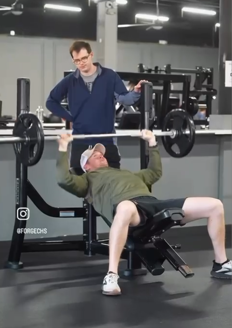 Personal trainer spotting member on bench press at Forge CHS West Ashley Charleston SC