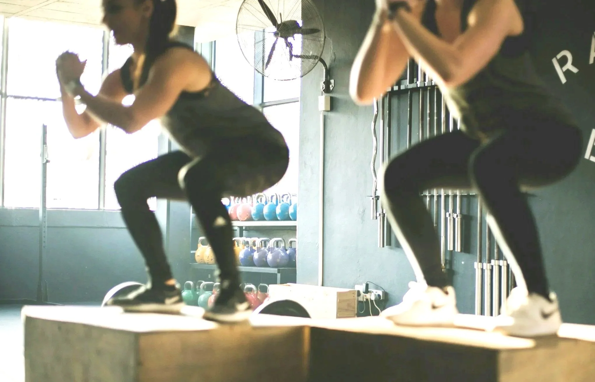 Athletes doing box jumps at Forge CHS, a clean 24/7 strength and fitness gym in West Ashley, Charleston, SC.