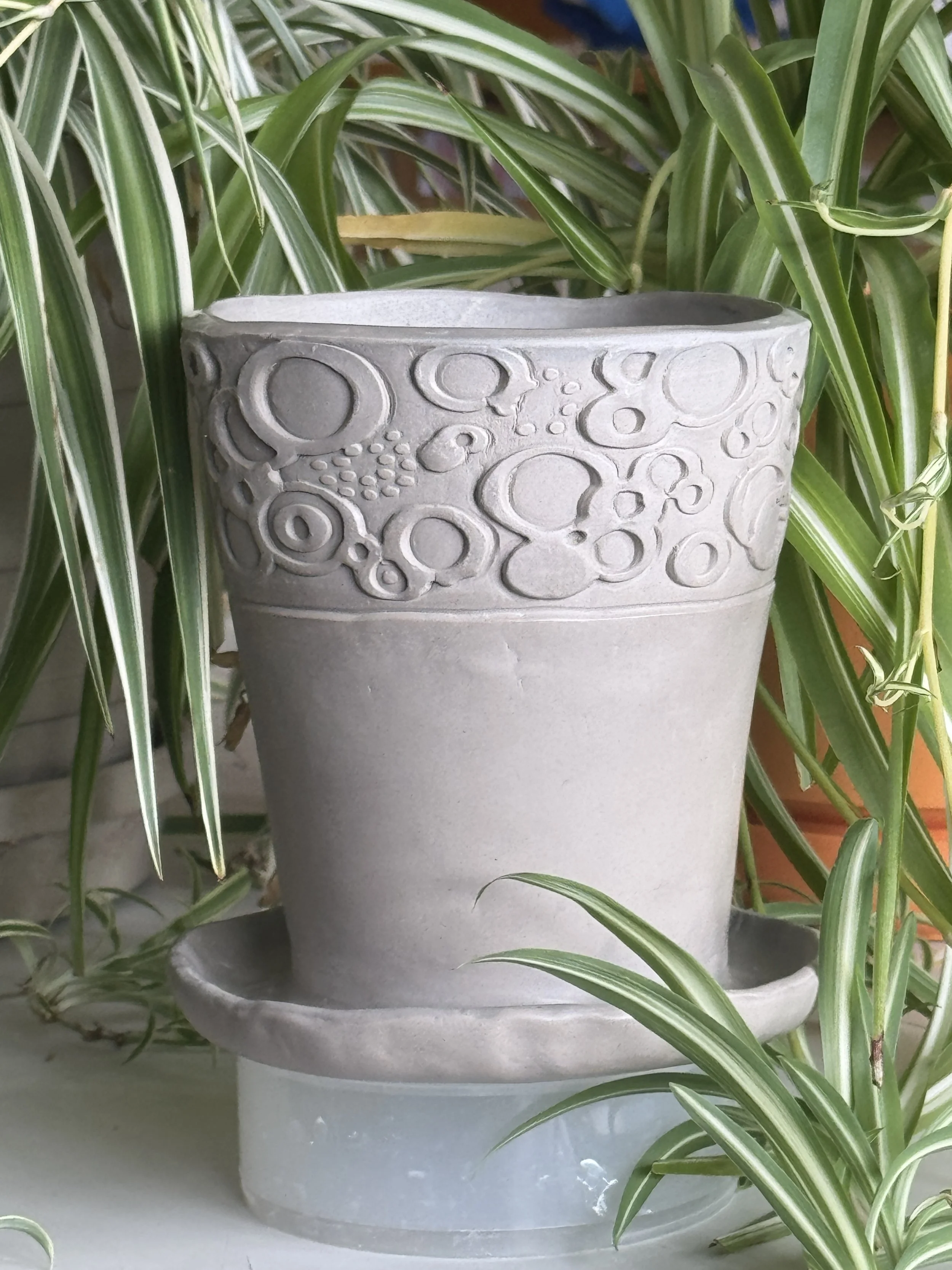 a picture of a grey clay planter