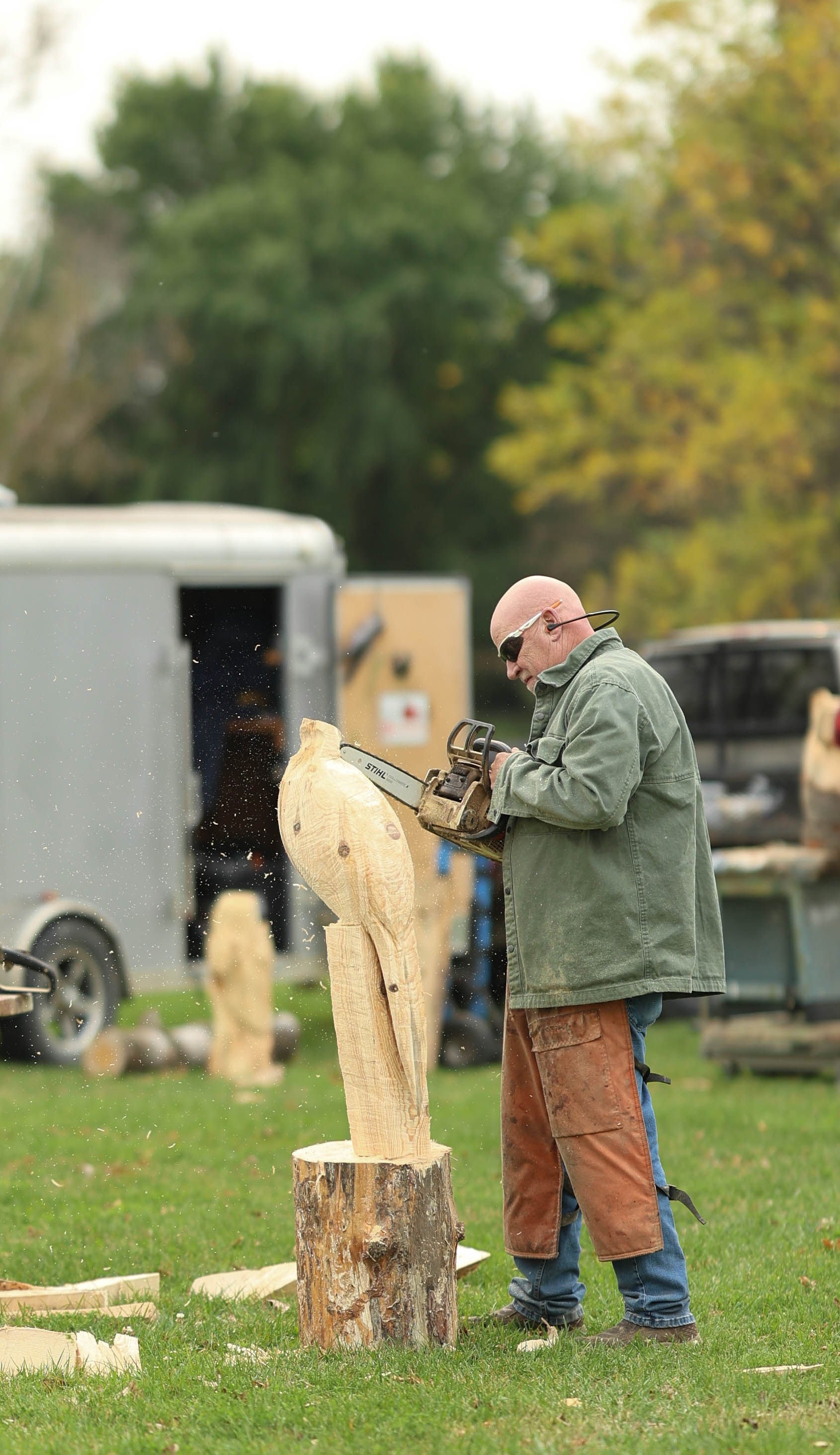 chainsaw carving by an artist on the RiverPlace patio