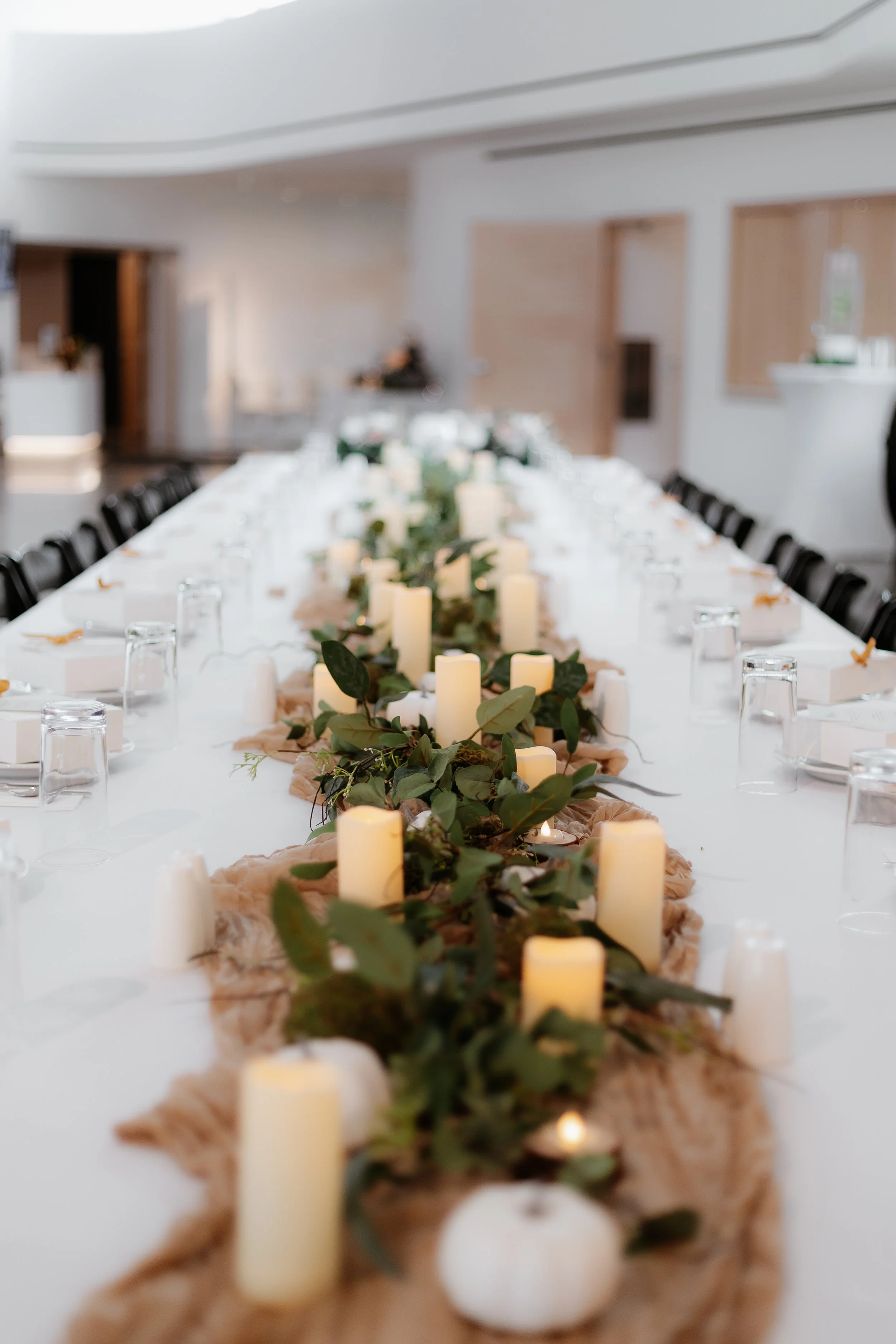 a long view of a centerpiece at an event in the RiverPlace gallery