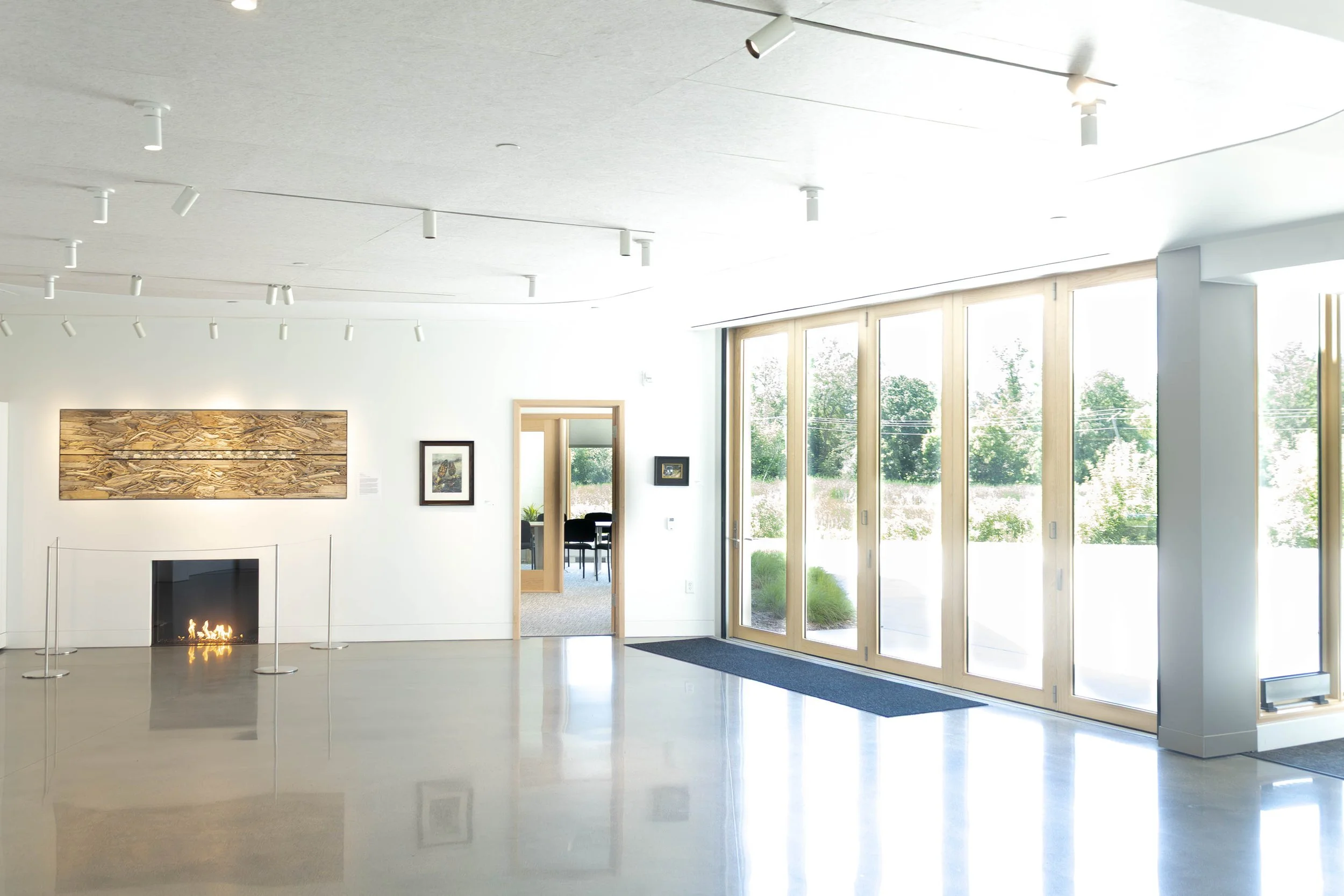 patio doors off of the RiverPlace gallery by the fireplace
