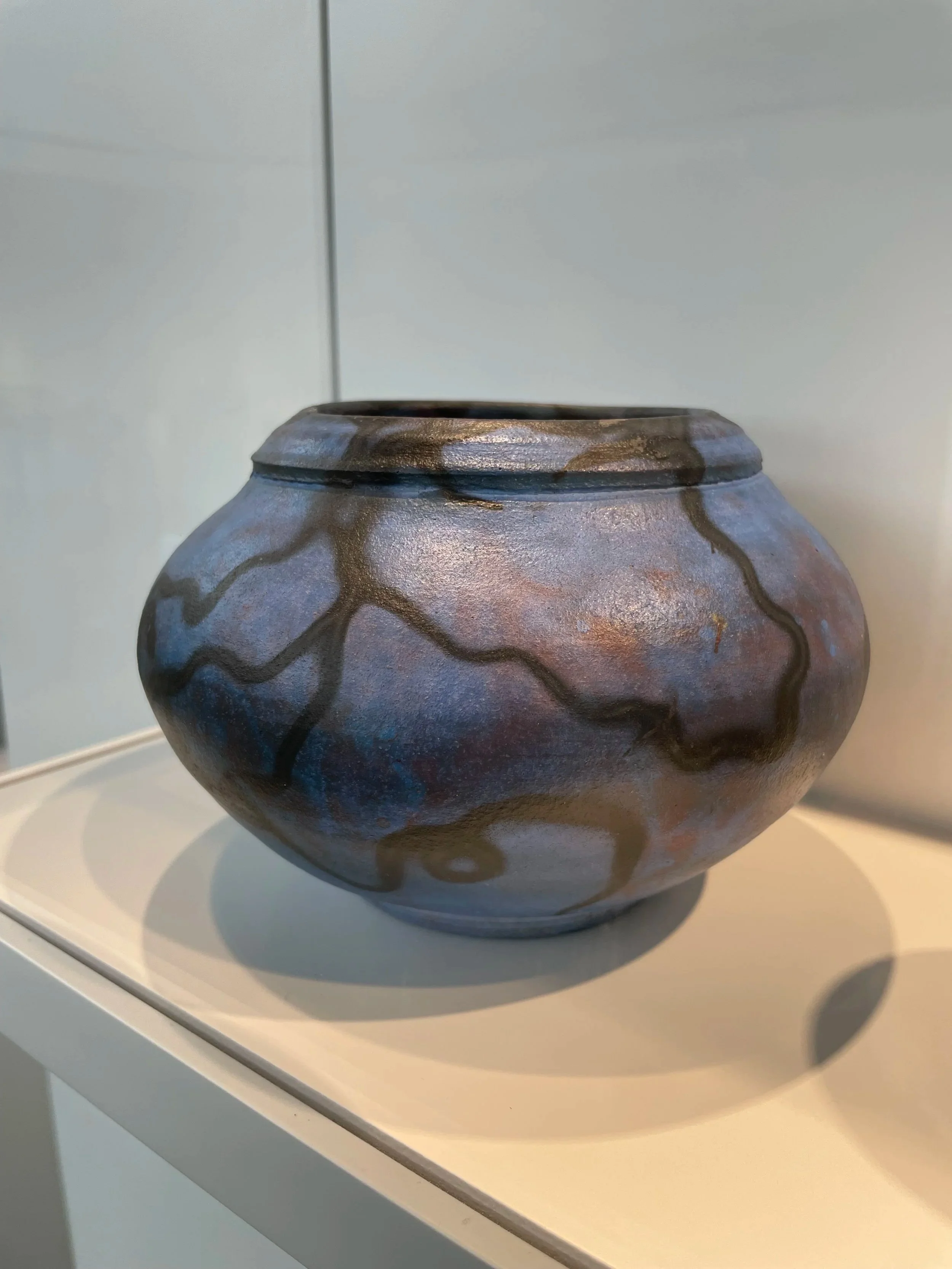a small blue cobalt raku-fired bowl/vase