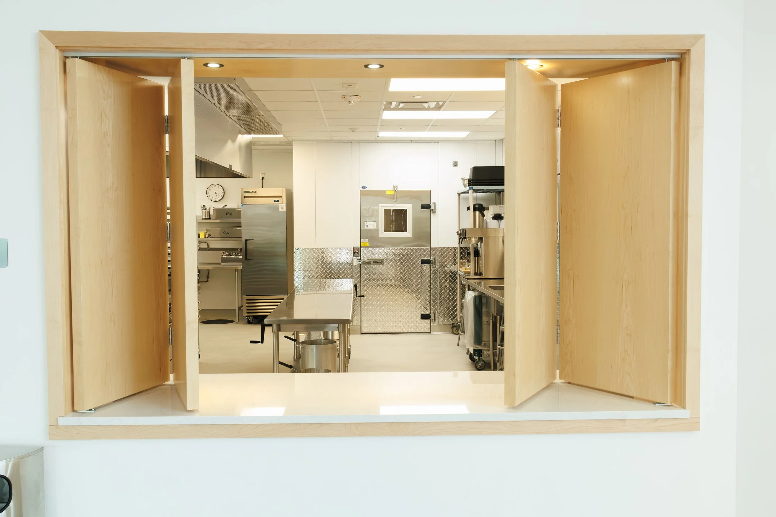a photo of the RiverPlace commercial kitchen from the gallery looking into the concession area