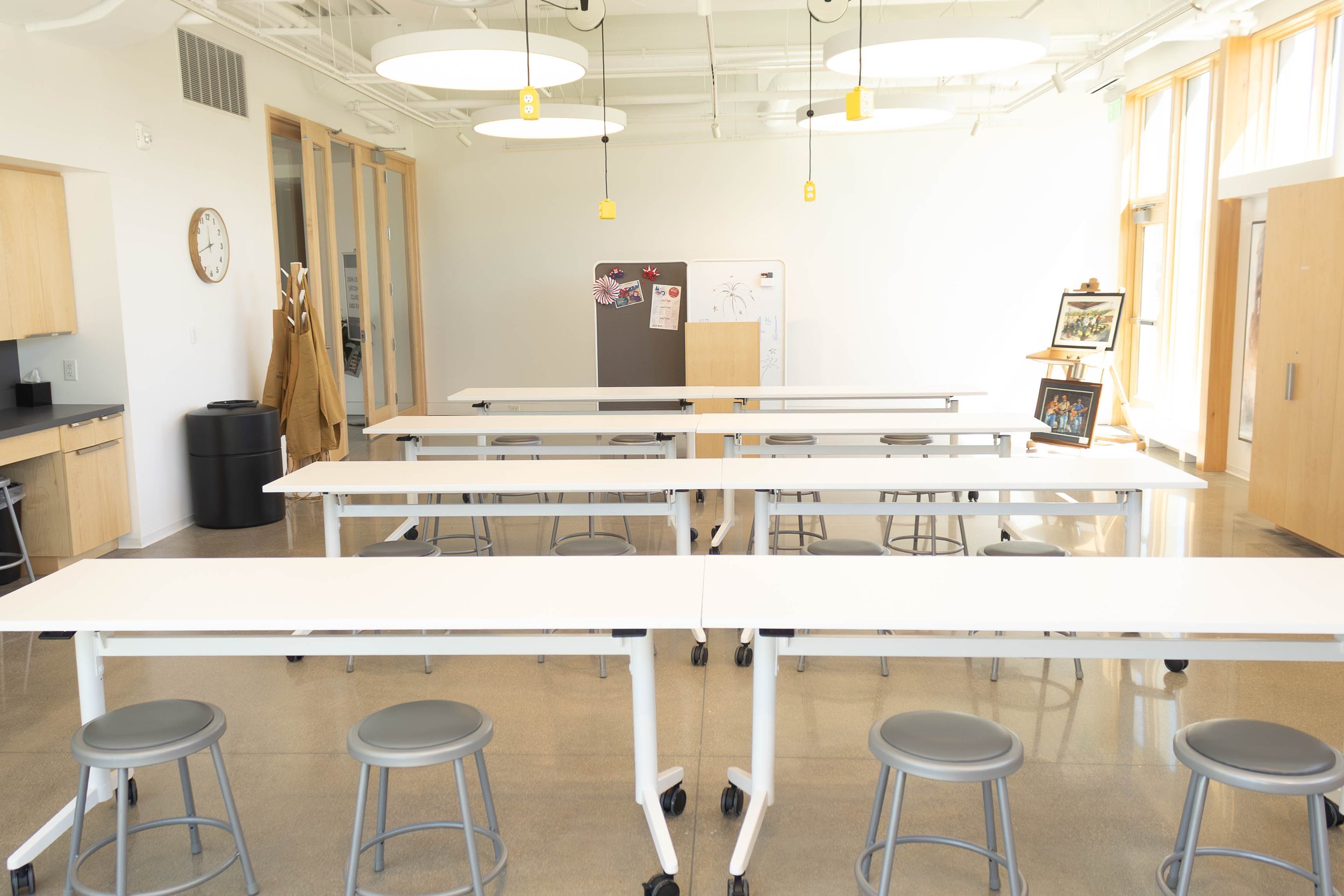 the RiverPlace classroom with tables and lots of natural light