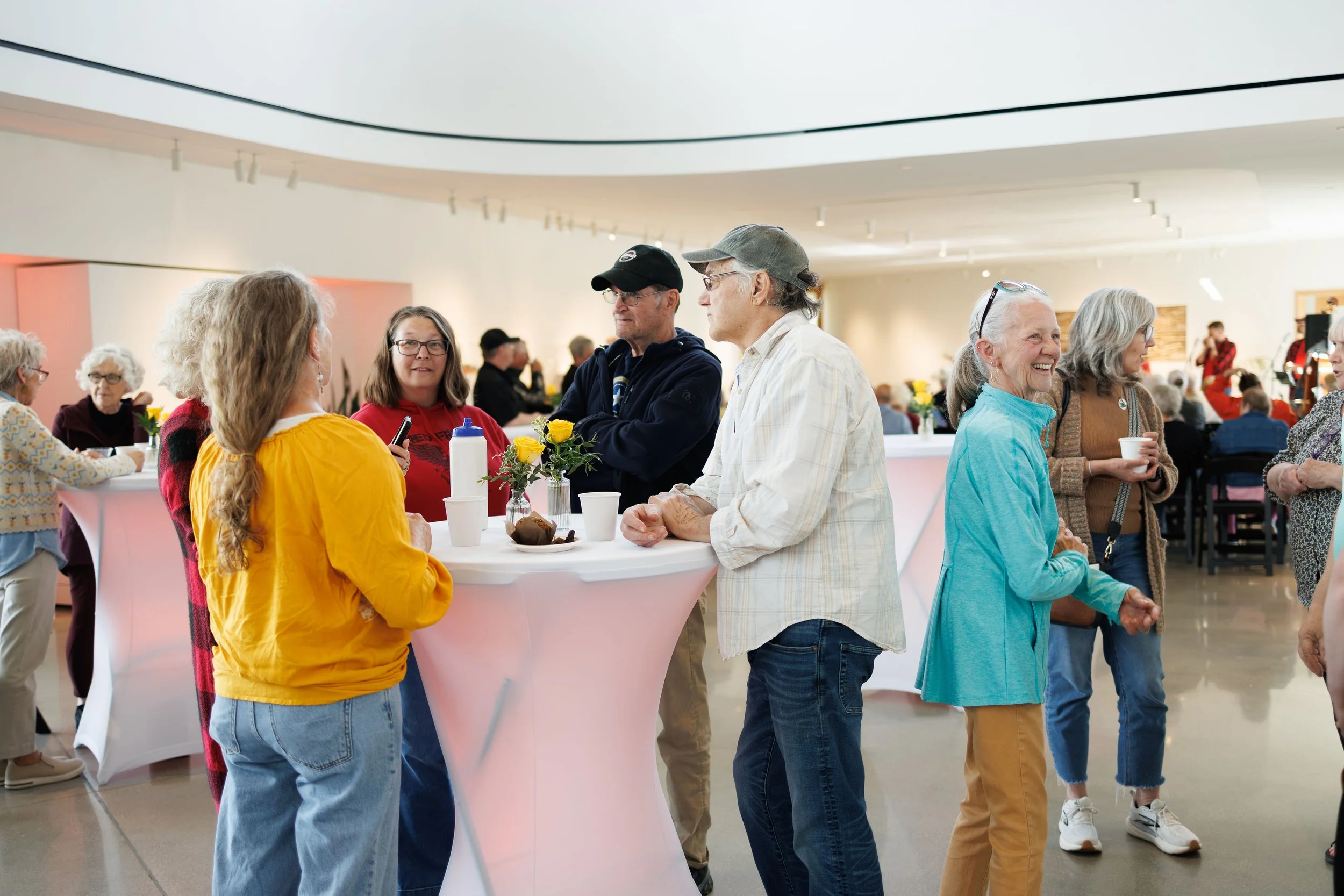 people visiting during a reception in the RiverPlace gallery