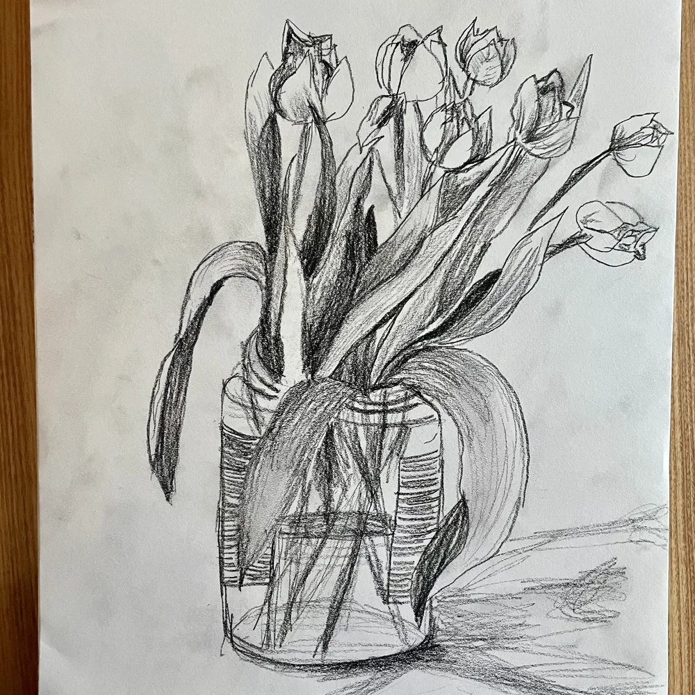 Charcoal sketch of a jar of tulips by artist Surabhi Pandey