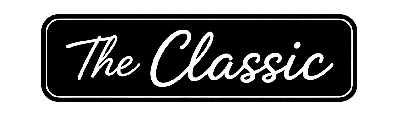 A black rectangular sign with rounded corners displaying the white cursive text 'The Classic'.