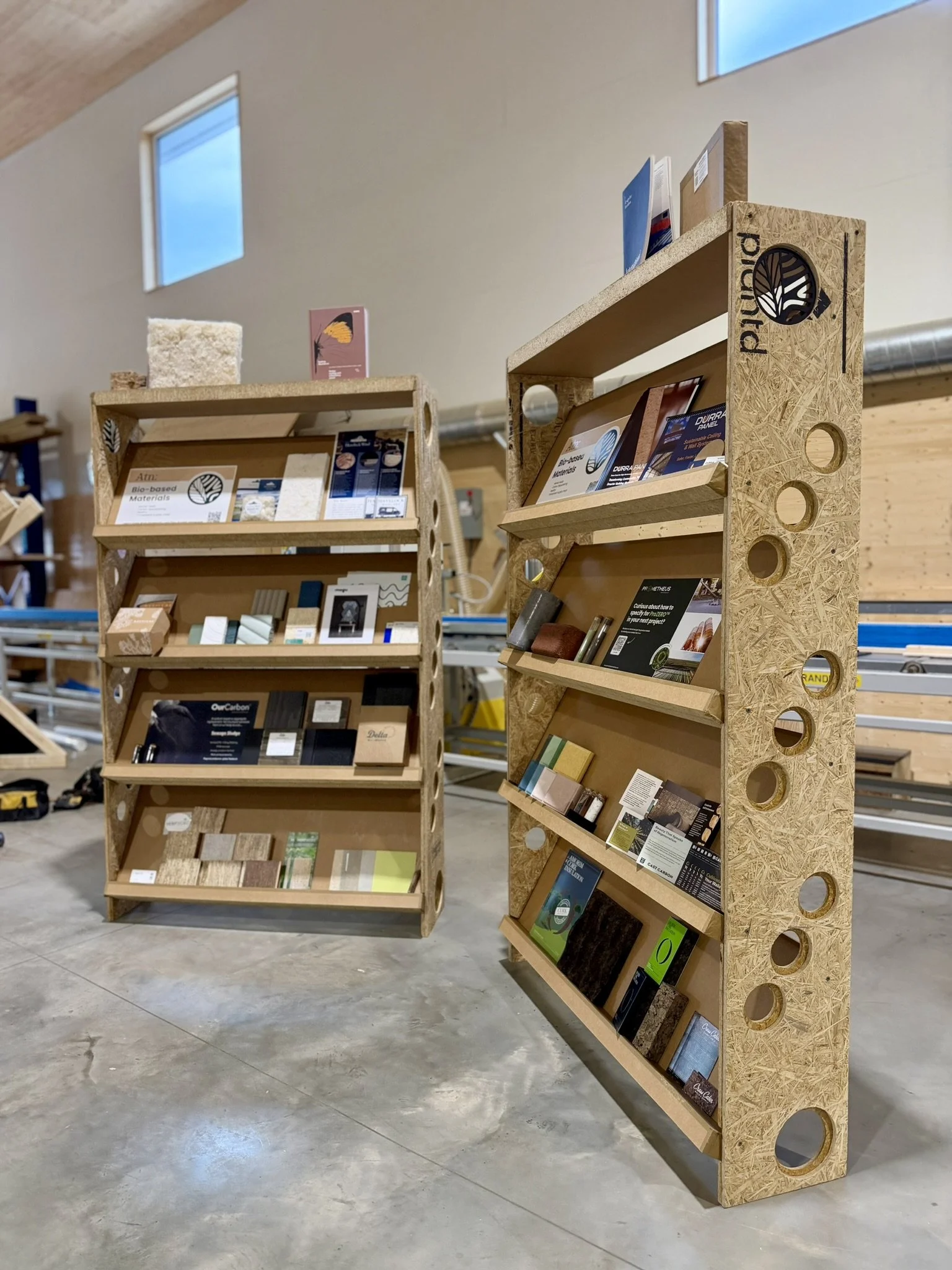 compressed grass board bookshelf hosting bio-derived materials for construction