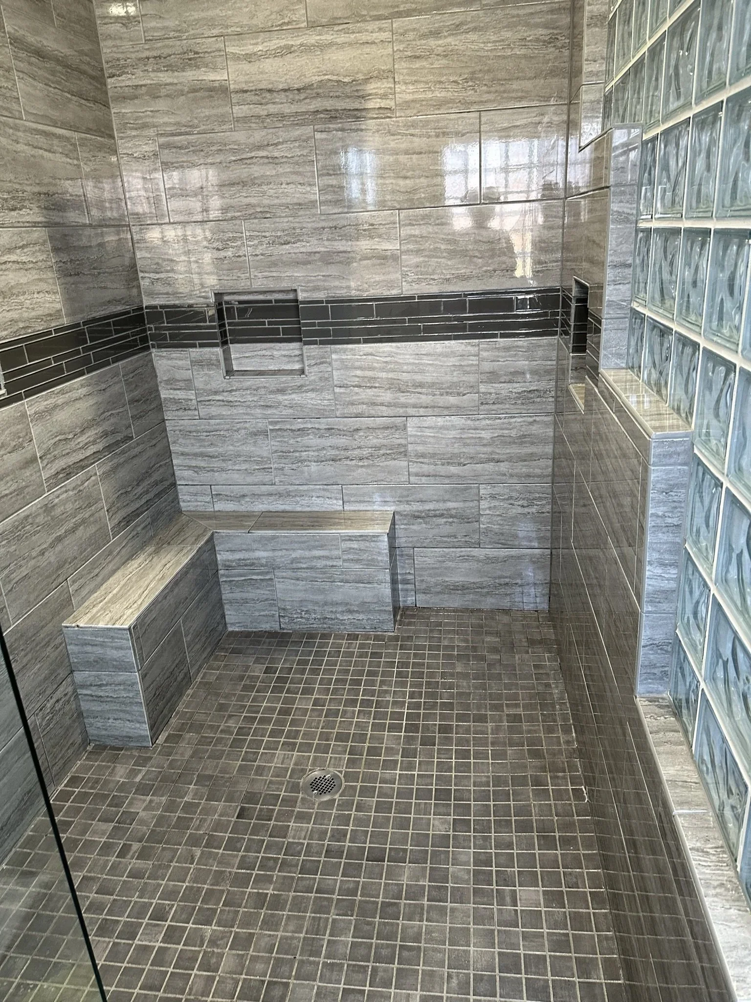 Shower After Deep Cleaning
A refreshed shower after detailed cleaning addressed buildup across the tile, grout, floor, and surrounding surfaces.