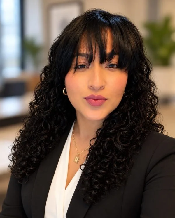 Hulda Castañeda, owner of Castañeda’s Cleaning Services, wearing a black blazer in a portrait for her janitorial services company.
