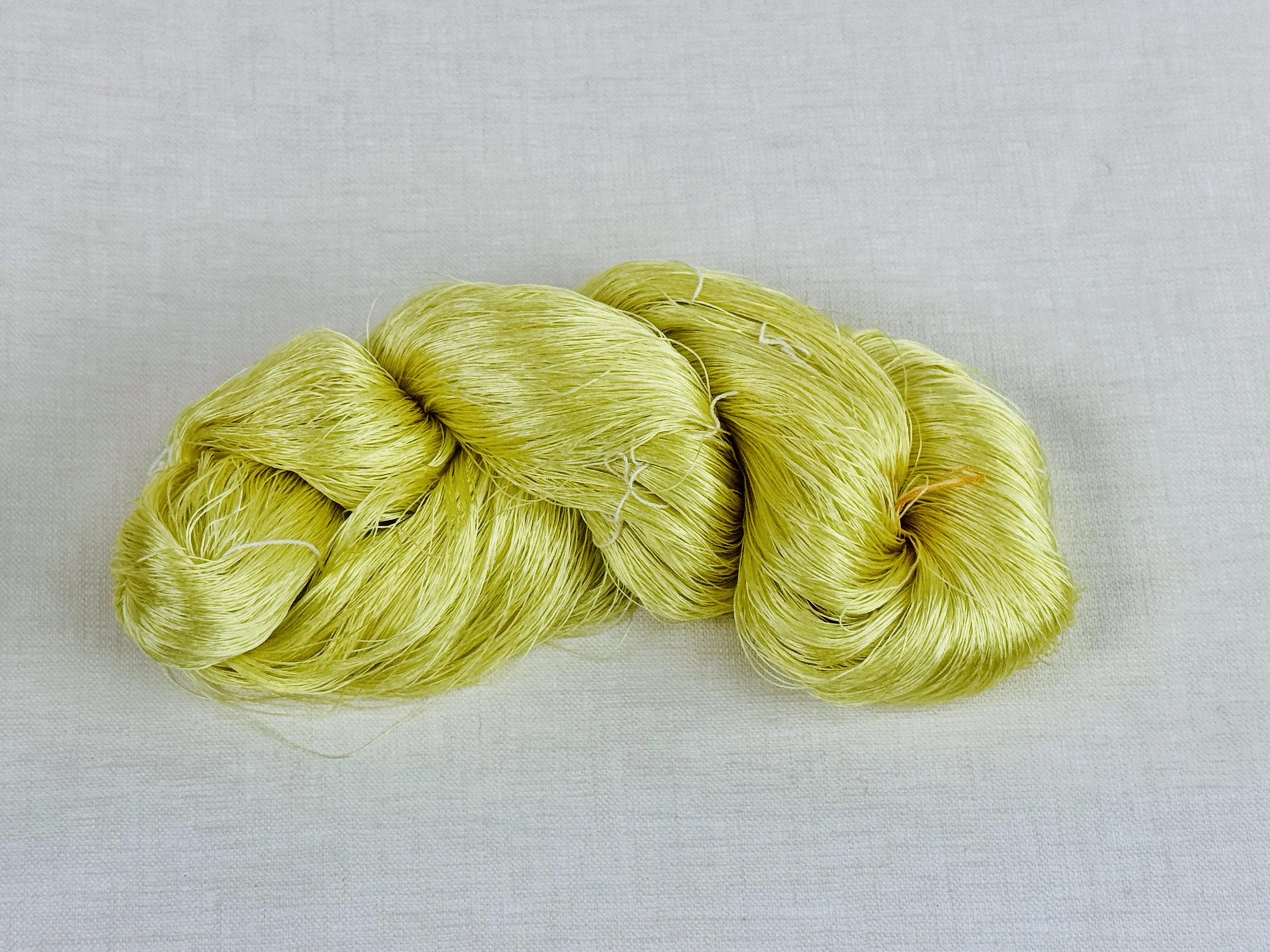skein of fine reeled Thai silk yarn dyed with rice leaf