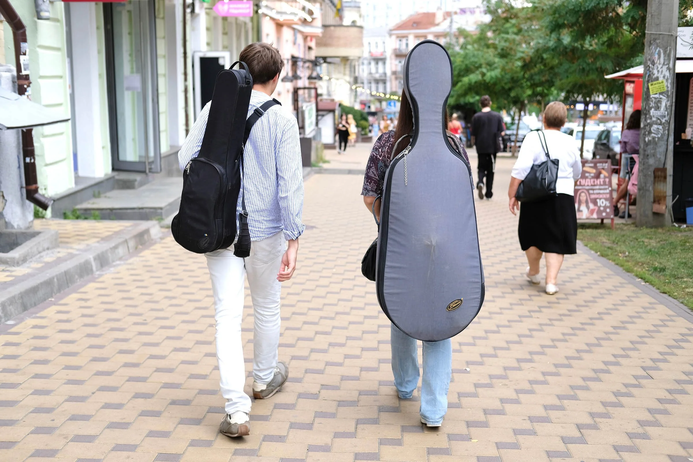 Musicians traveling with their instrument cases