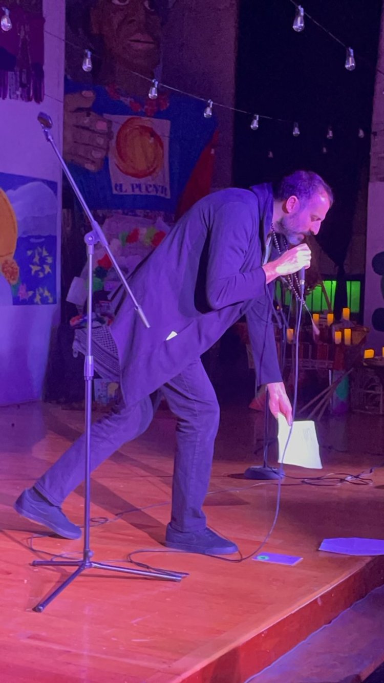 Poet Marcos De La Cruz performing during one of the Encuentros at El Puente.