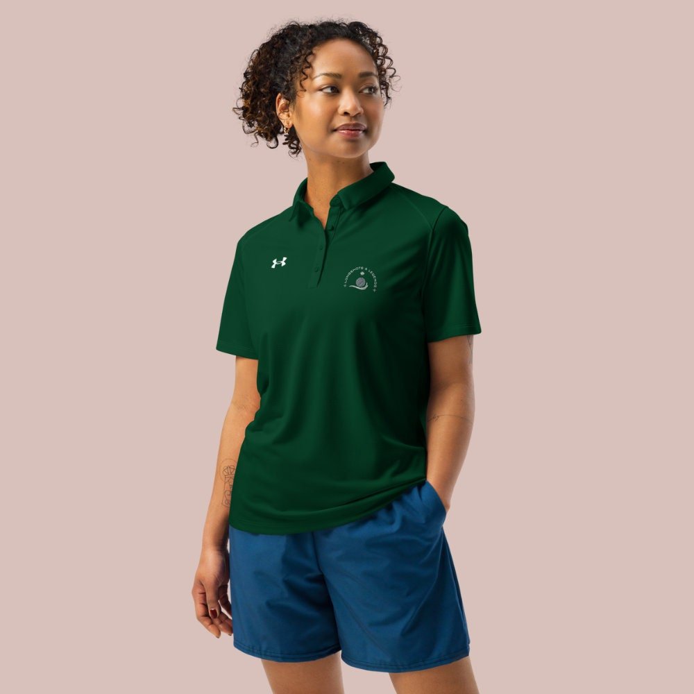 Custom embroidered women’s Under Armour® collared polo shirt with basketball logo in spruce green. Celebrate with the Longshots and Legends collection of athletic wear.