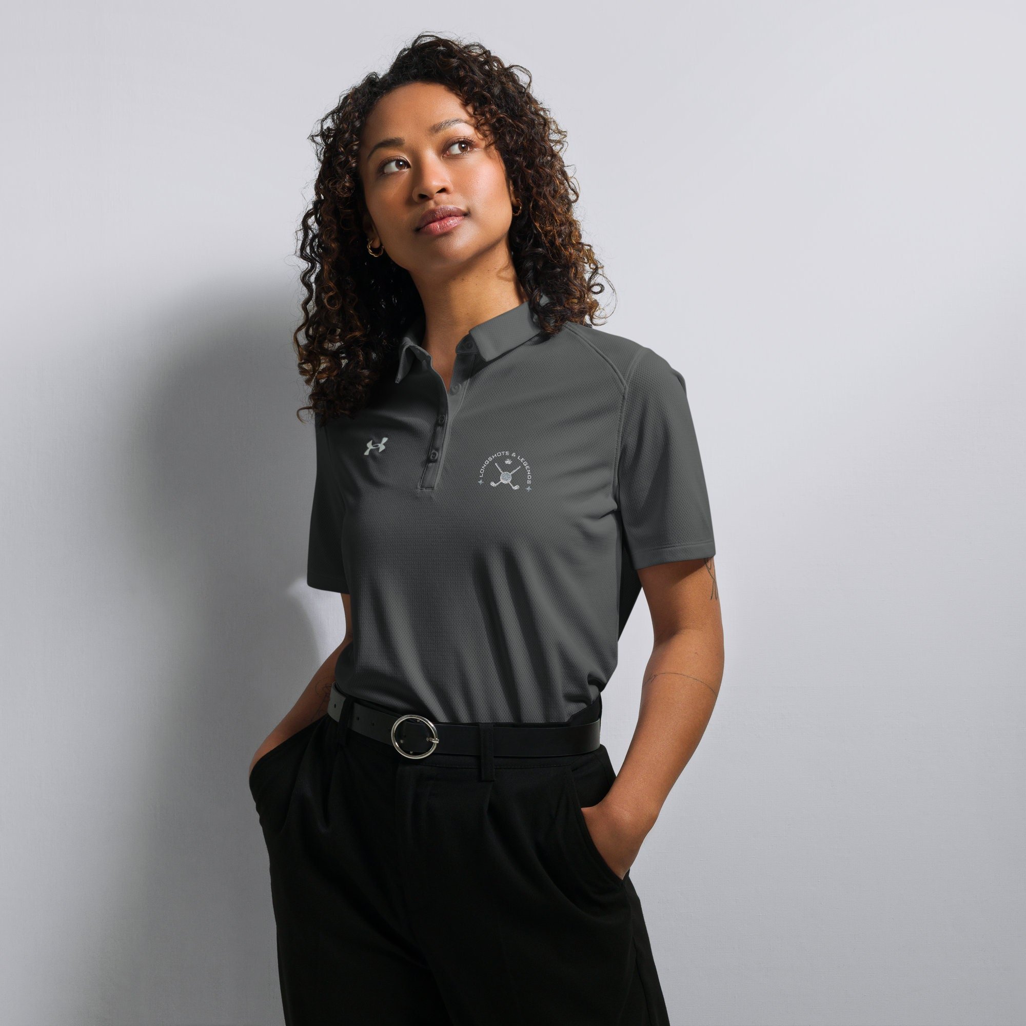Custom embroidered women’s Under Armour® collared polo shirt with golf logo. Celebrate with the Longshots and Legends collection of athletic wear.