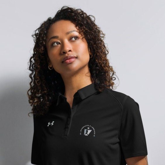 Custom embroidered women’s Under Armour® collared polo shirt with baseball logo in black. Celebrate with the Longshots and Legends collection of athletic wear.
