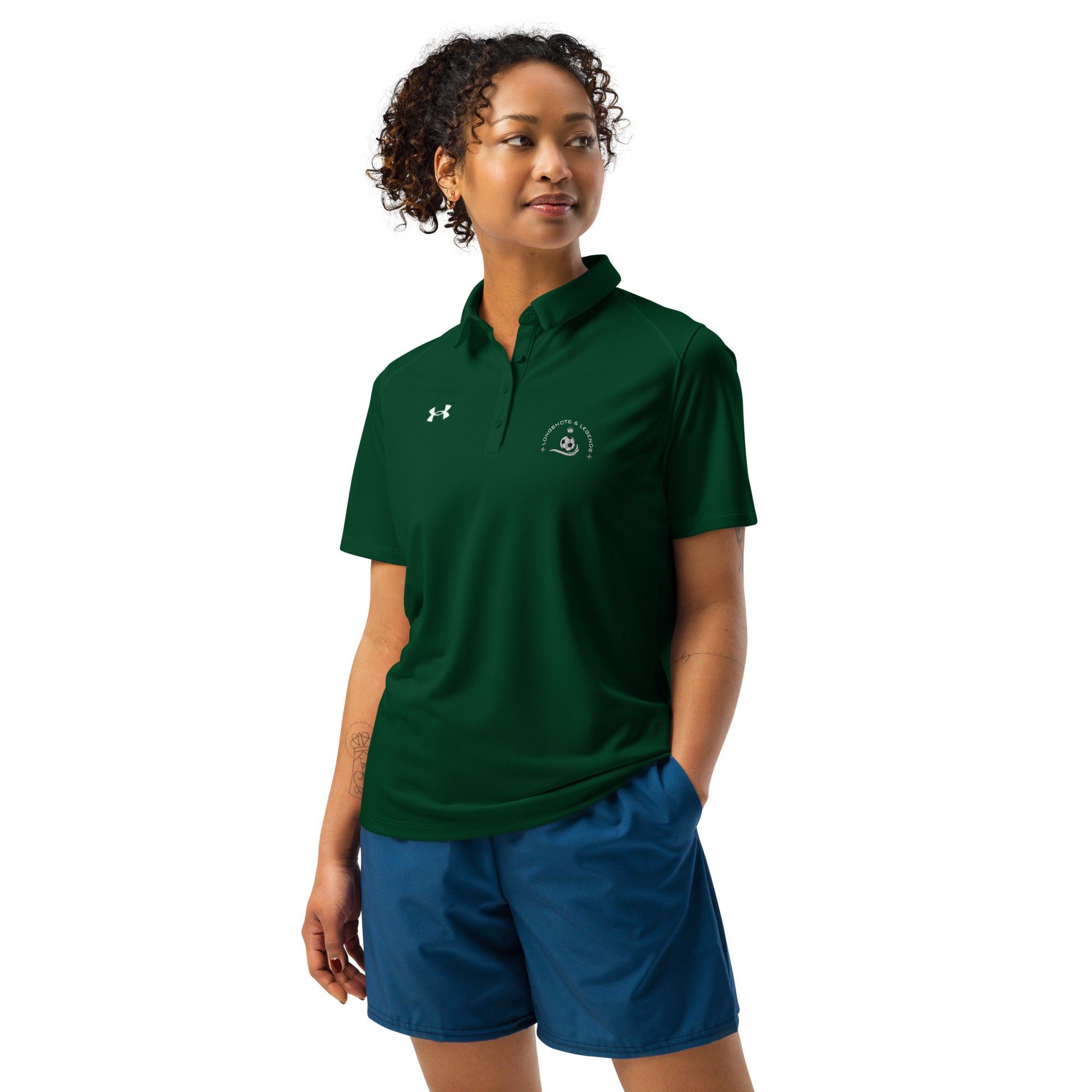 Custom embroidered women’s Under Armour® collared polo shirt with soccer logo in spruce green. Celebrate with the Longshots and Legends collection of athletic wear.
