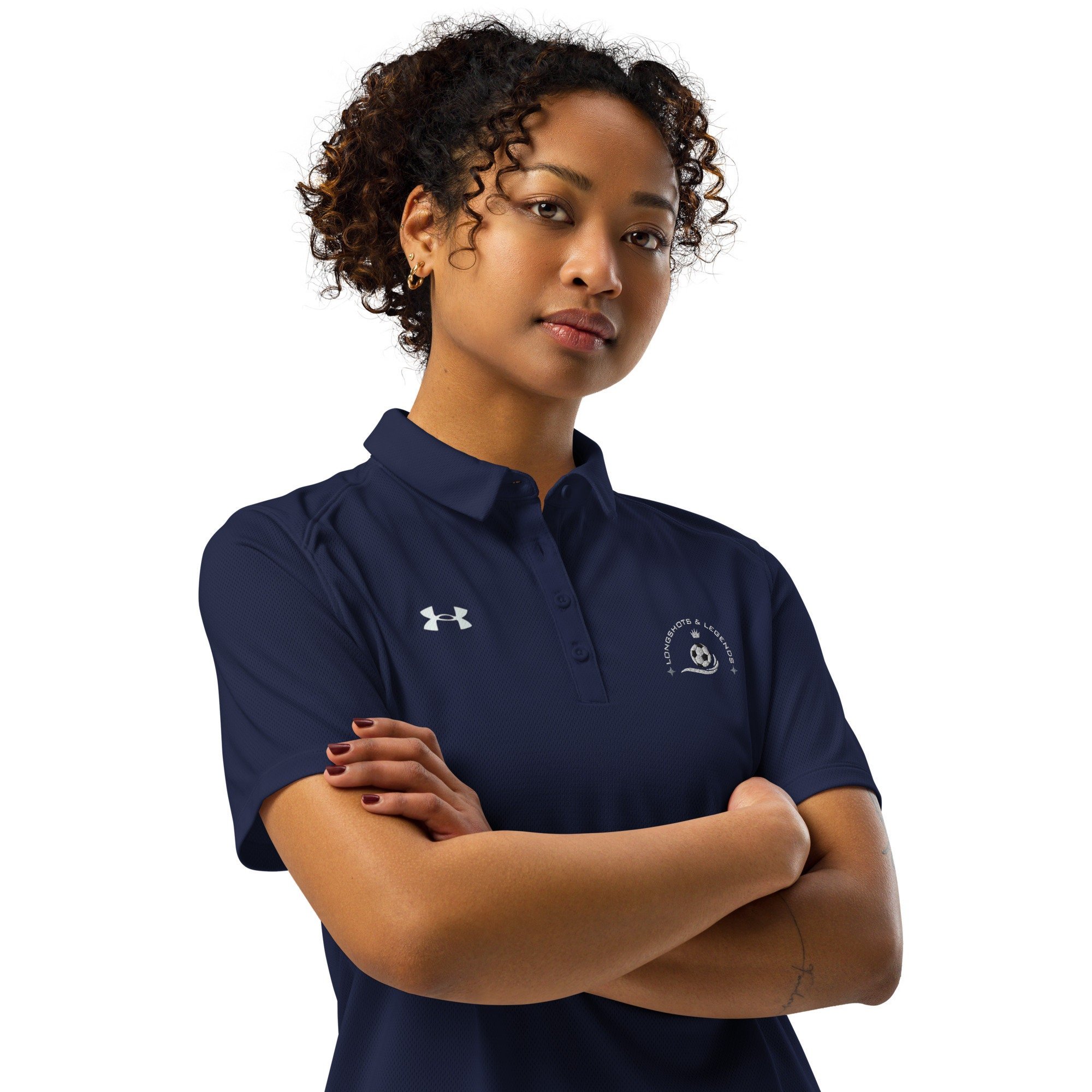 Custom embroidered women’s Under Armour® collared polo shirt with soccer logo in navy blue. Celebrate with the Longshots and Legends collection of athletic wear.