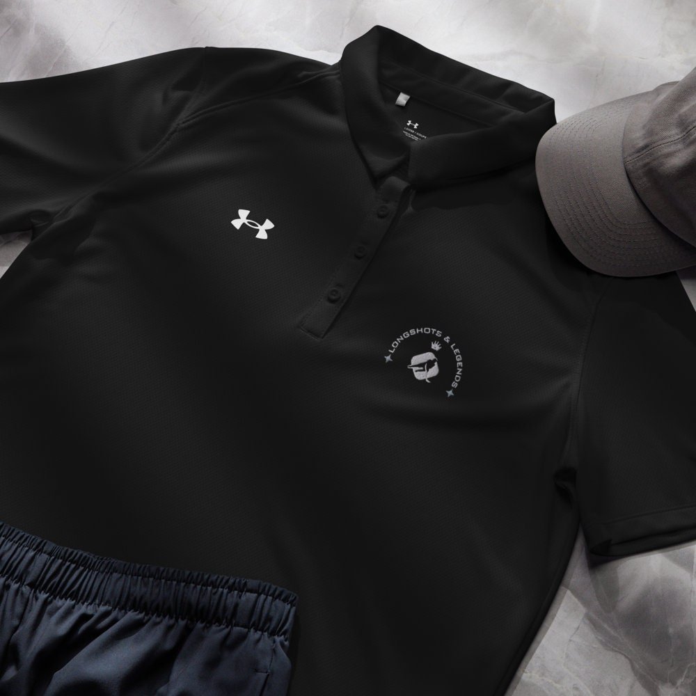 Custom embroidered women’s Under Armour® collared polo shirt with hockey logo in black. Celebrate with the Longshots and Legends collection of athletic wear.