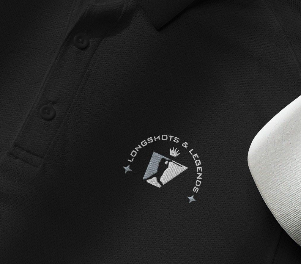 Custom embroidered men’s Under Armour® collared polo shirt with baseball logo in black. Celebrate with the Longshots and Legends collection of athletic wear.