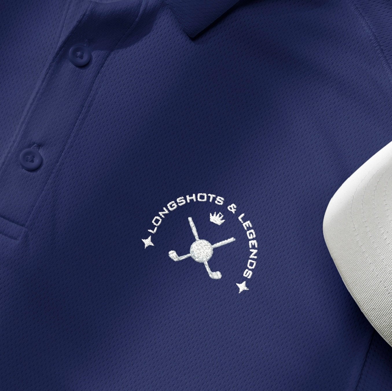 Custom embroidered men’s Under Armour® collared polo shirt with golf logo in navy blue. Celebrate with the Longshots and Legends collection of athletic wear.