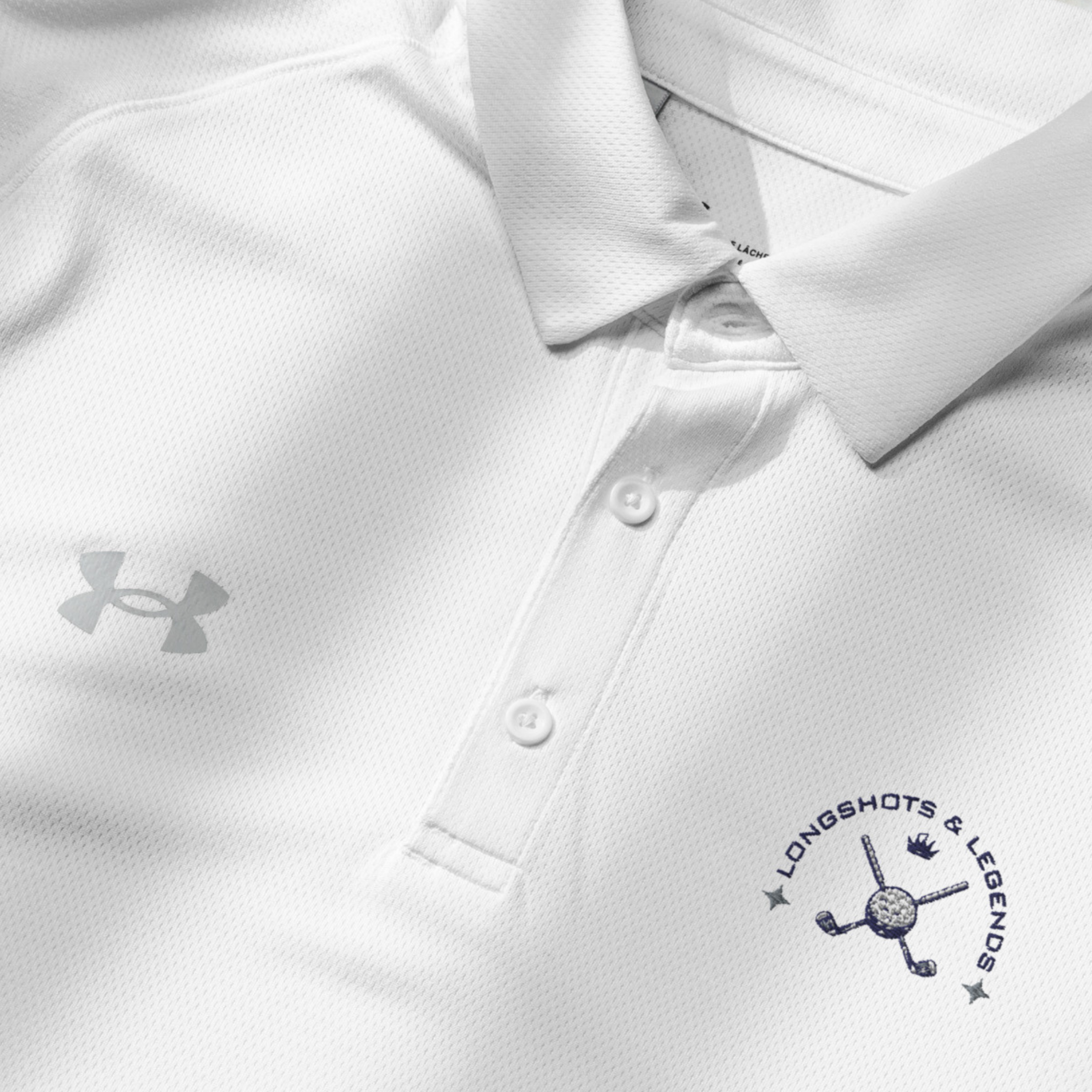 Custom embroidered men’s Under Armour® collared polo shirt with golf logo in white. Celebrate with the Longshots and Legends collection of athletic wear.