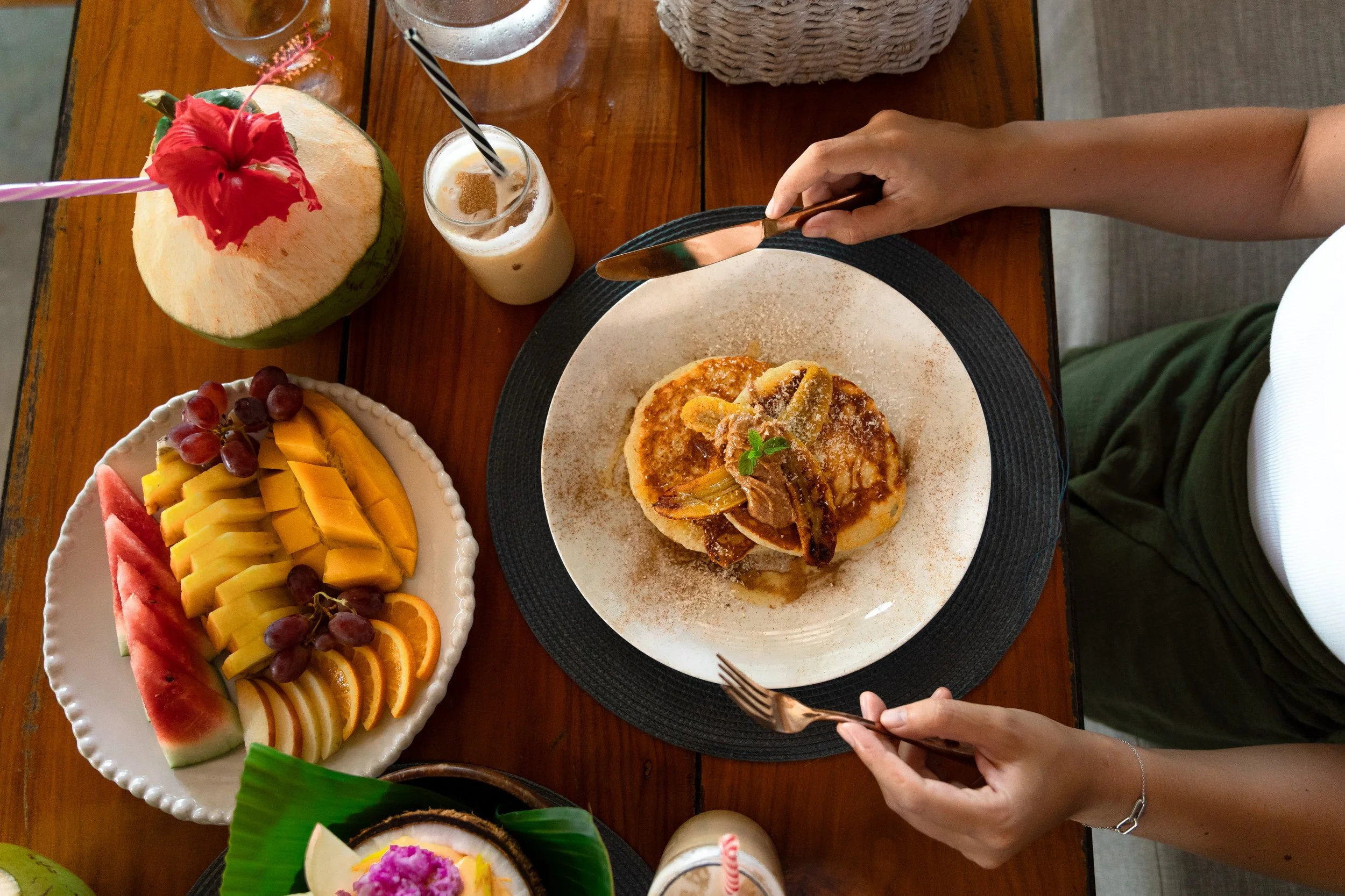 A plate of fruits and pancakes for a filling breakfast before the day's adventure at Daloy Yoga Retreat