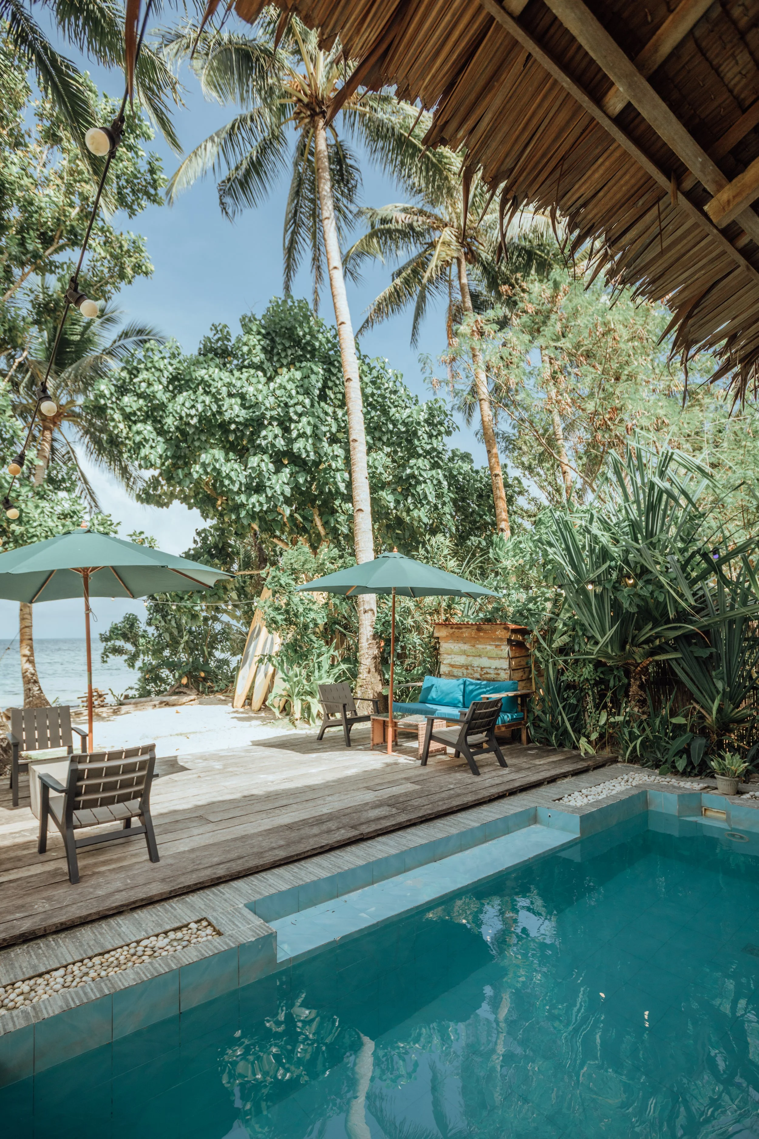 Swimming pool with white sand beachfront views at Siargao Philippines Yoga retreat with Well With Avril