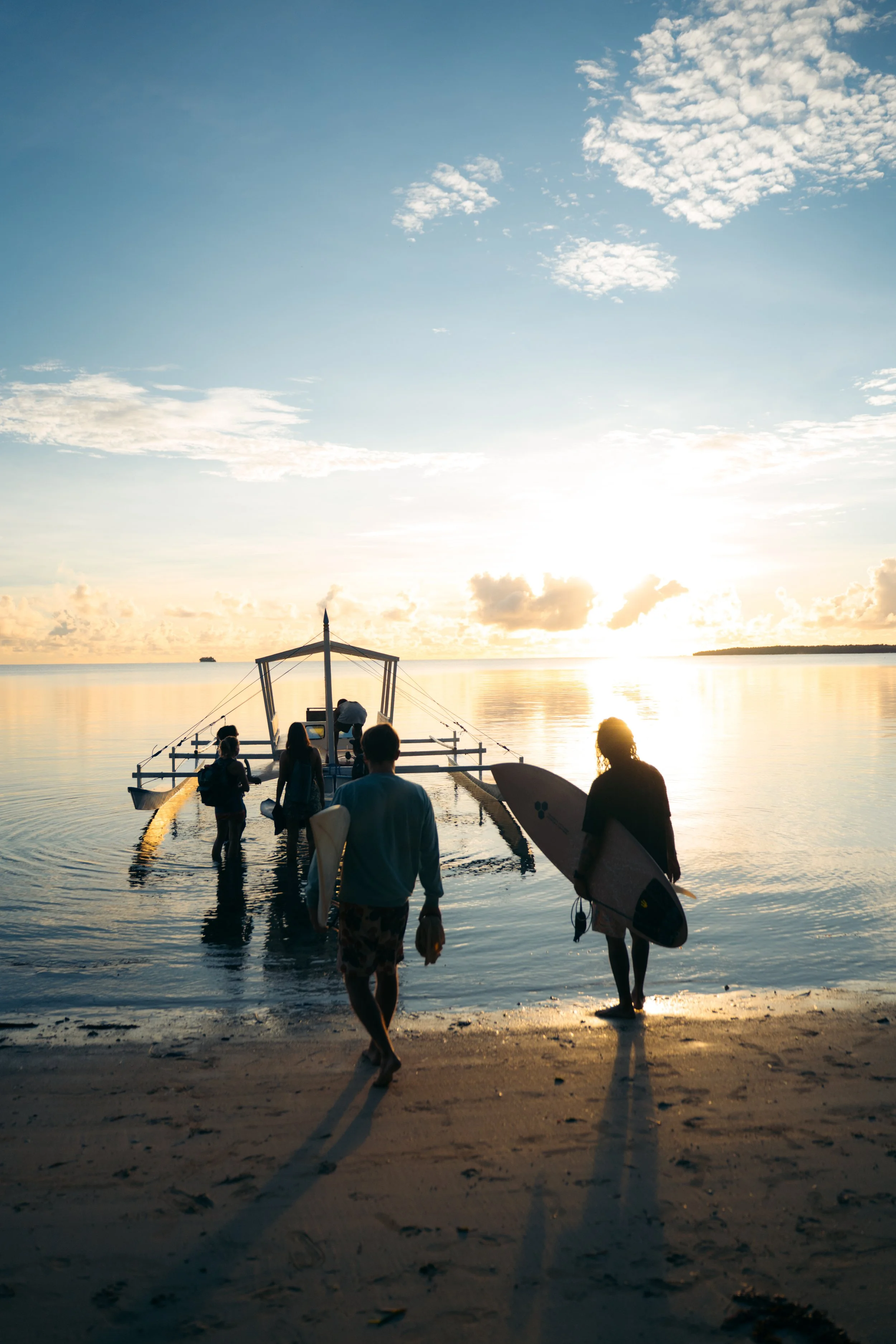 Surf excursion and boat trip during Daloy Yoga and Wellness Retreat in Siargao Philippines with Well With Avril.
