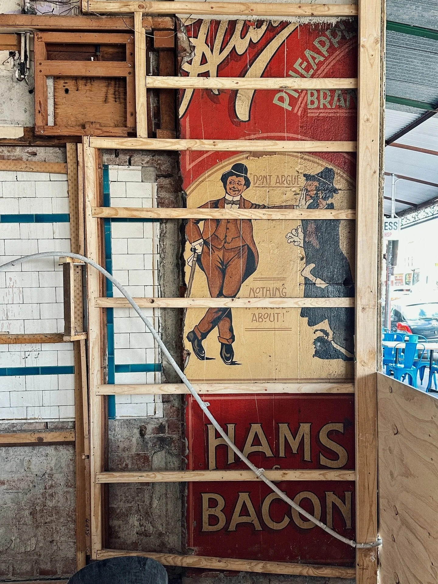 DON&rsquo;T ARGUE 
773 Nicholson Street

For a brief few hours on a Friday arvo, a renovation crew peeled back the plaster inside an old shop and revealed THIS slab of century-old magic:

Hutton&rsquo;s Pineapple Brand Hams &amp; Bacon 

Complete wit