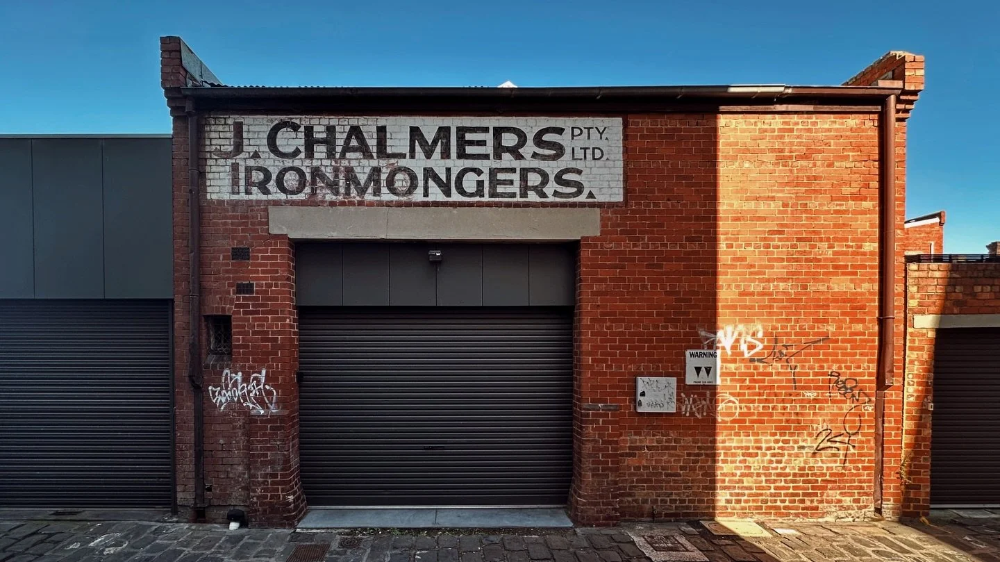 There it is on Burwood Road in Hawthorn East, not quite shouting, not quite gone.

J. Chalmers. Ironmonger.

John Chalmers started in the city. In 1898, advertising from 387 Lonsdale Street, &ldquo;late of Cobb &amp; Co.,&rdquo; offering cheap buildi