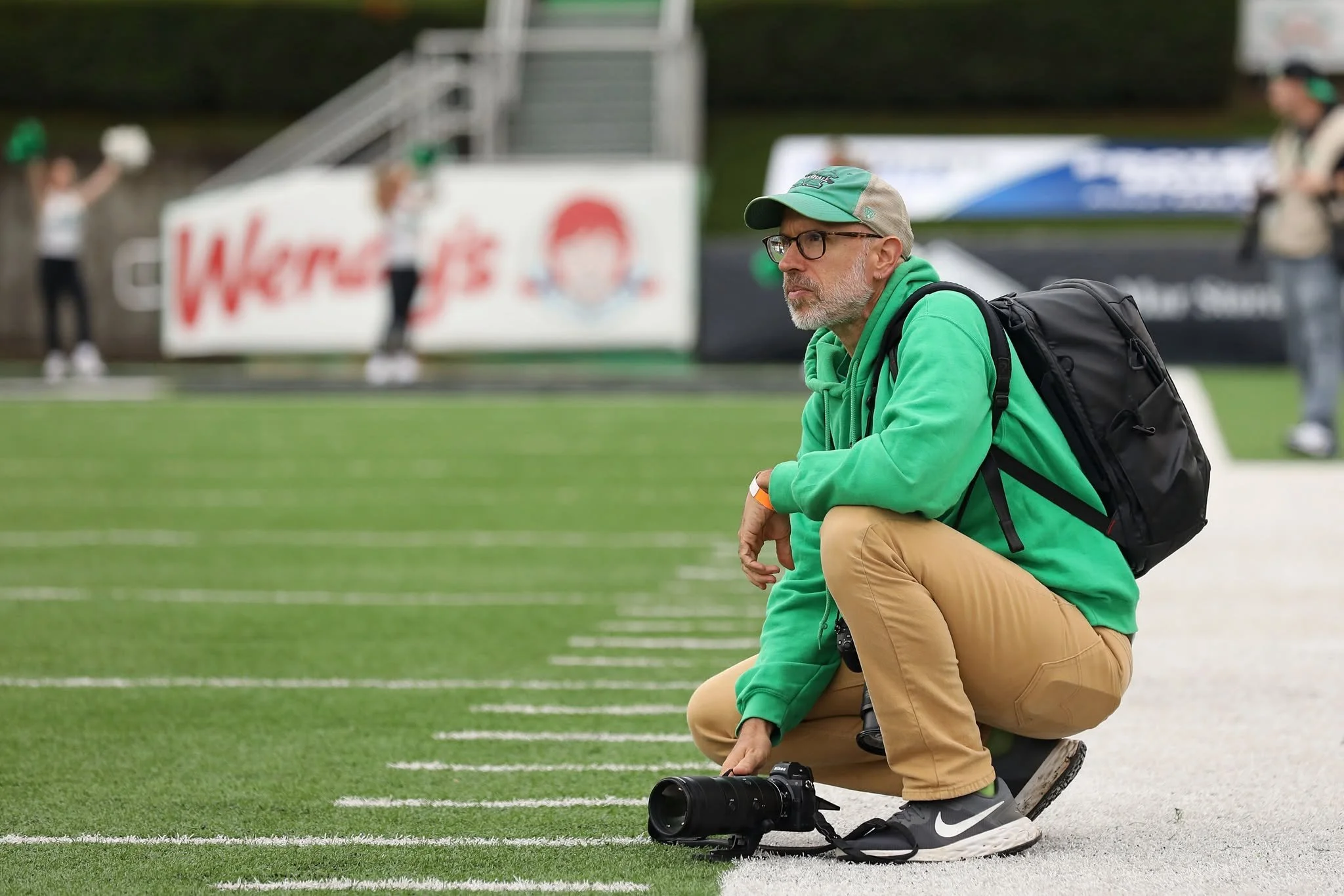 Alex Wilson photographing a Marshall University football game