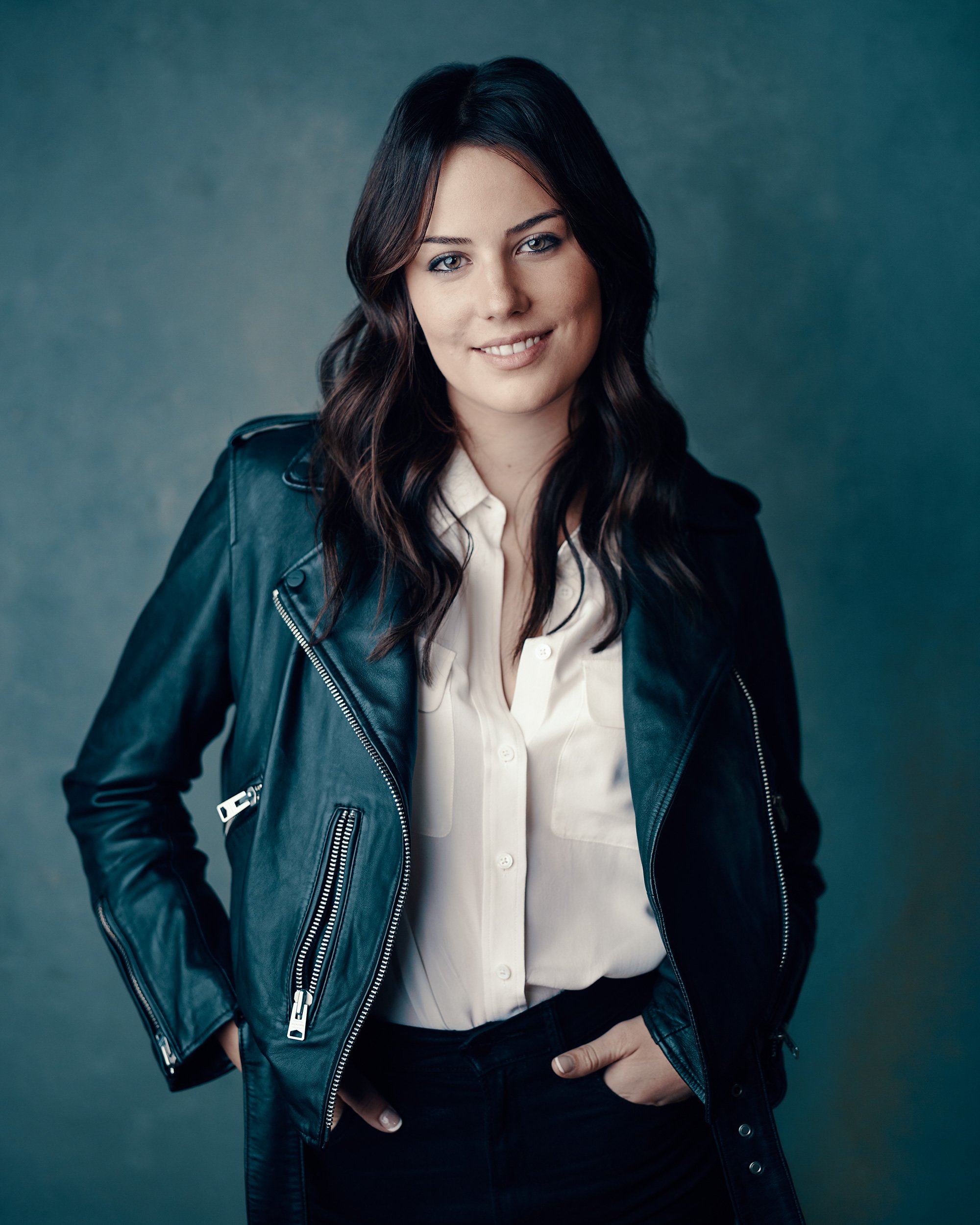 Headshot of a woman wearing a leather jacket in a San Francisco studio.