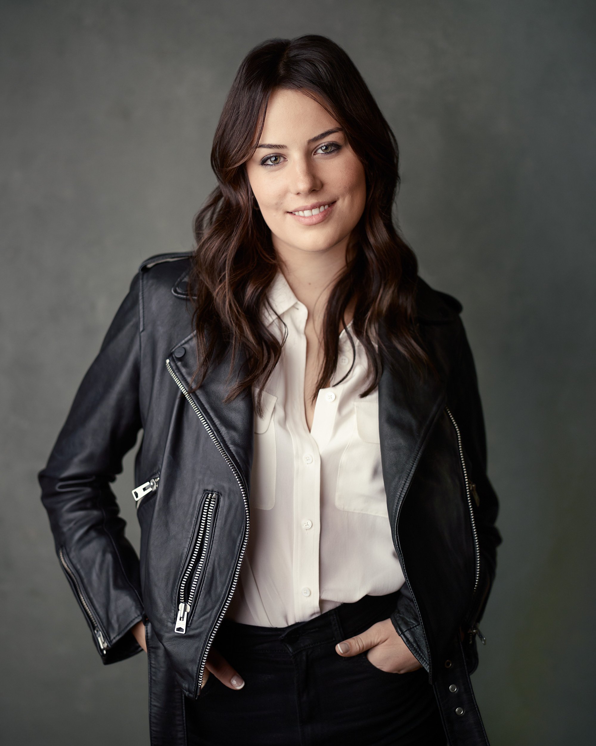 Headshot of a woman wearing a leather jacket in a San Francisco studio.
