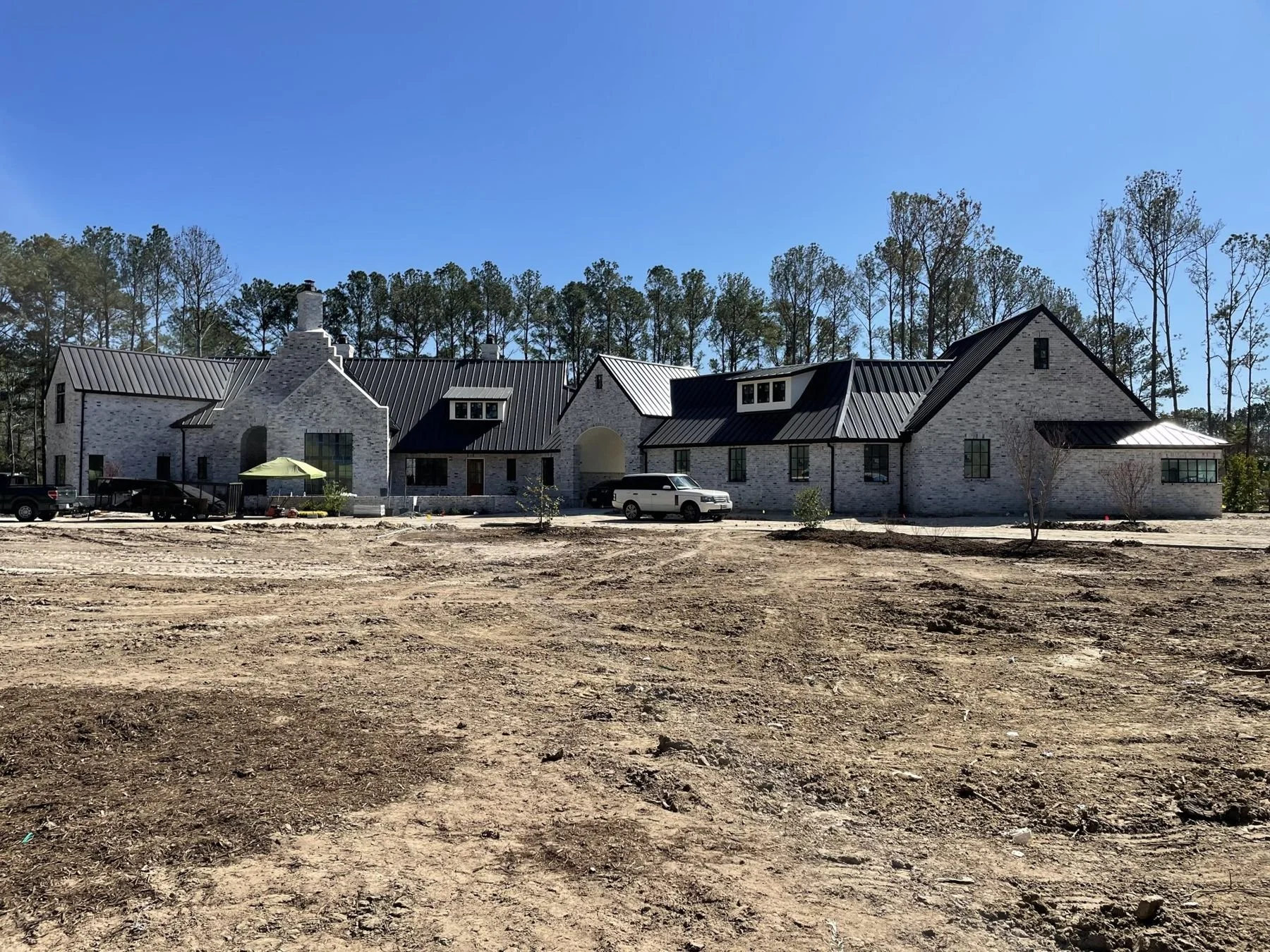 Before: a freshly cleared ten-acre lot around the new home
