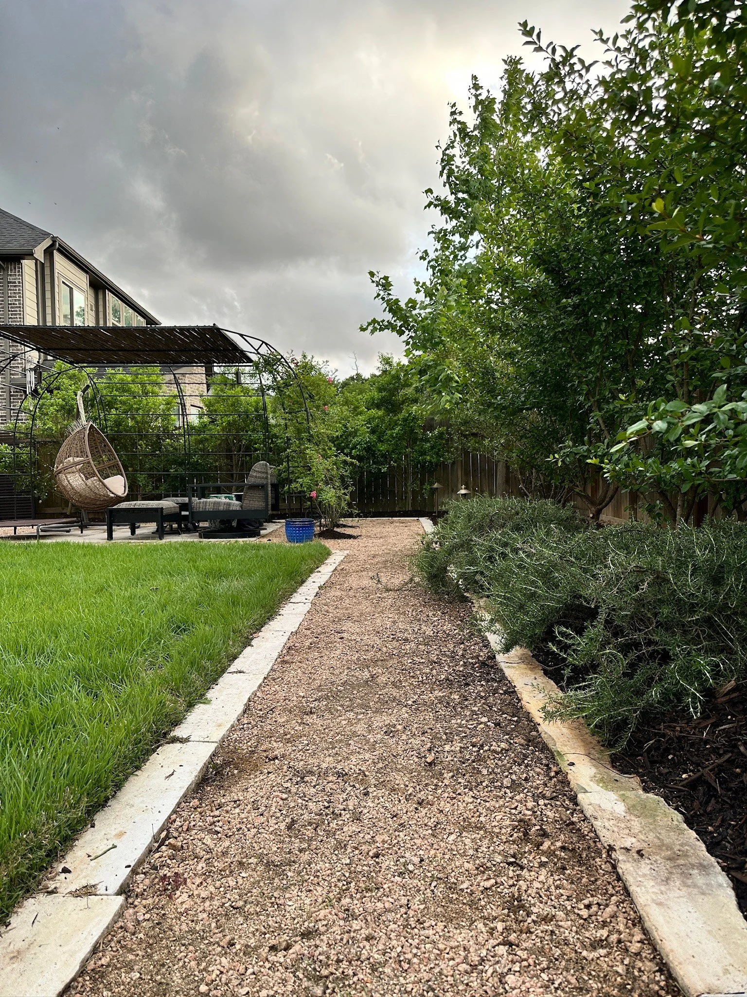 crushed granite path with limestone edging along the Zoysia lawn