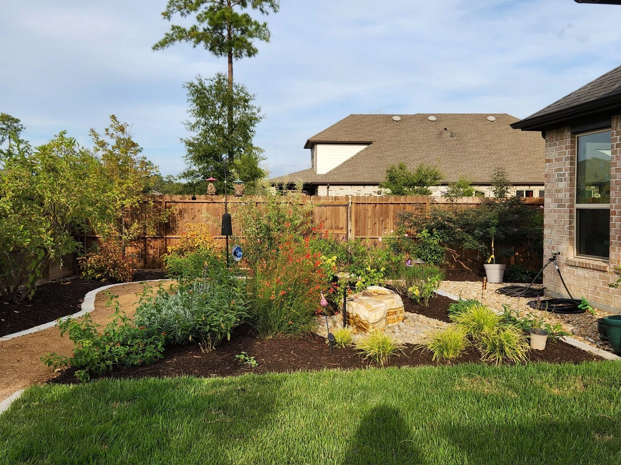 bird habitat garden with limestone raised beds