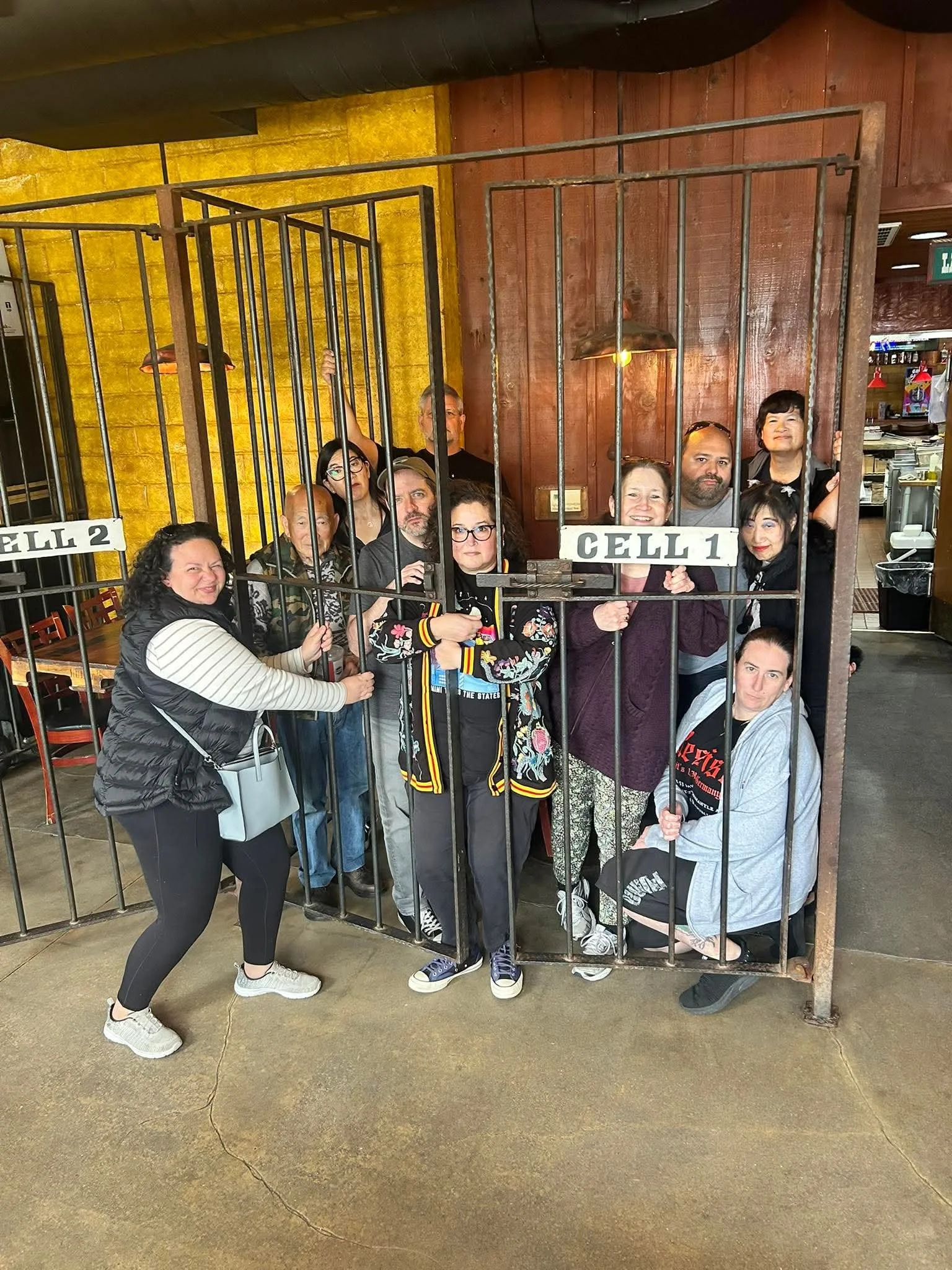 26-04 - santa-barbera - members-in-restaurant-jail-booth.JPEG