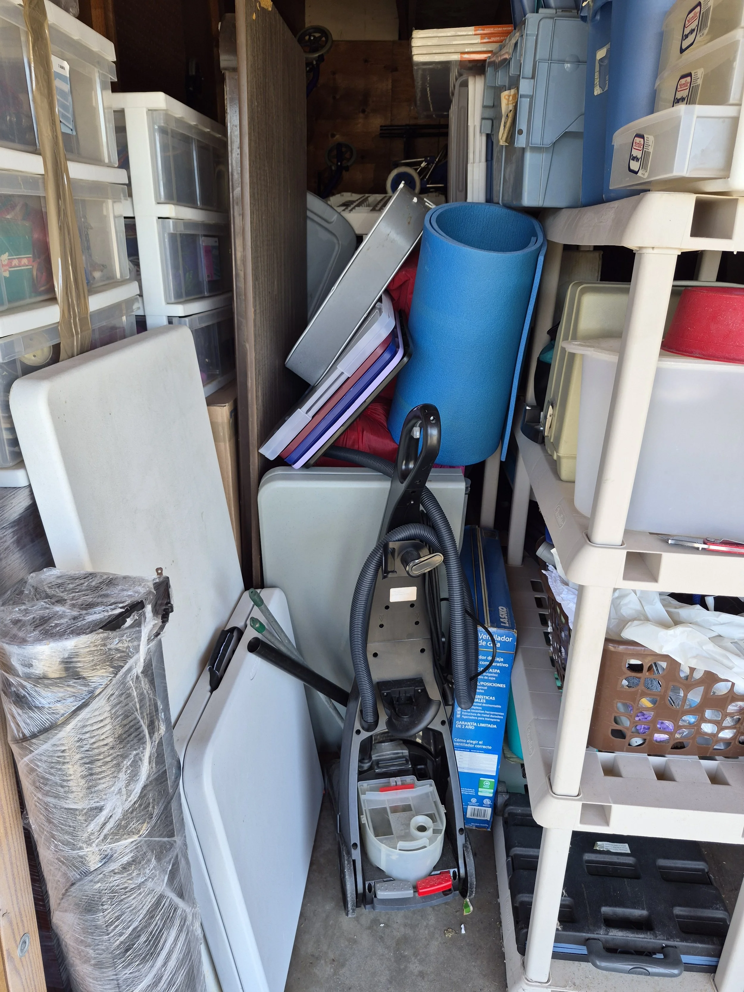 Before - a moving company dumped a completely unorganized mess into a 1 car garage. Shelves were not used properly and items that belong in the home were hidden all through out