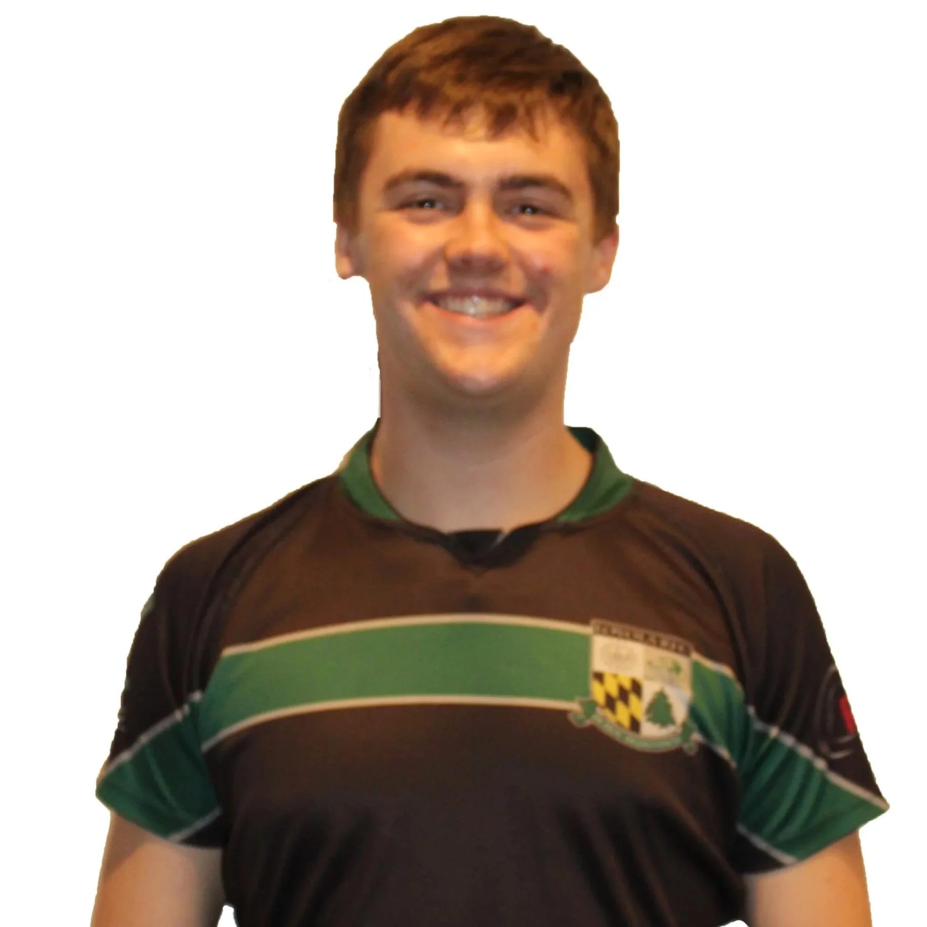 Person wearing a black and green sports jersey with an embroidered crest, standing against a light grey background.
