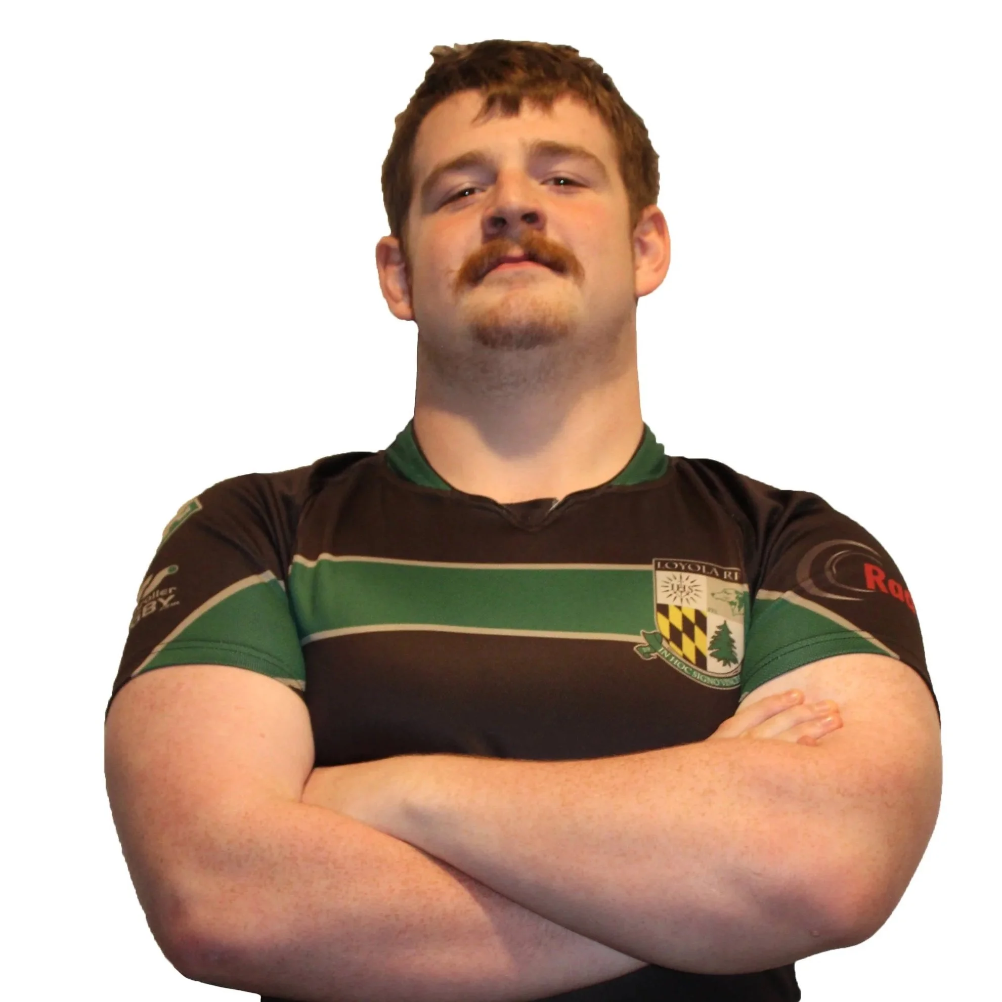 Portrait of a person wearing a dark sports jersey with a crest, looking at the camera.