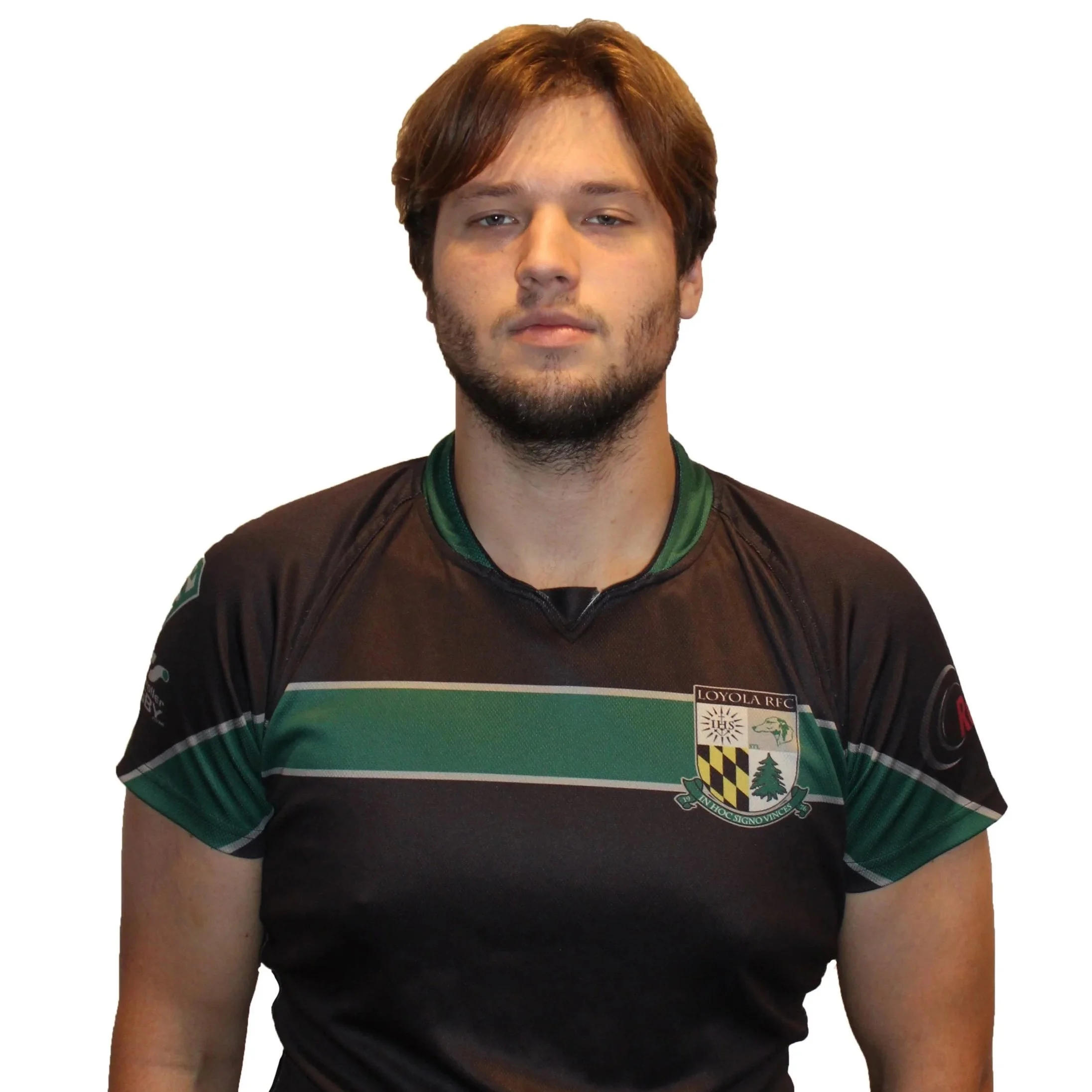 Man in a black and green jersey with arms crossed