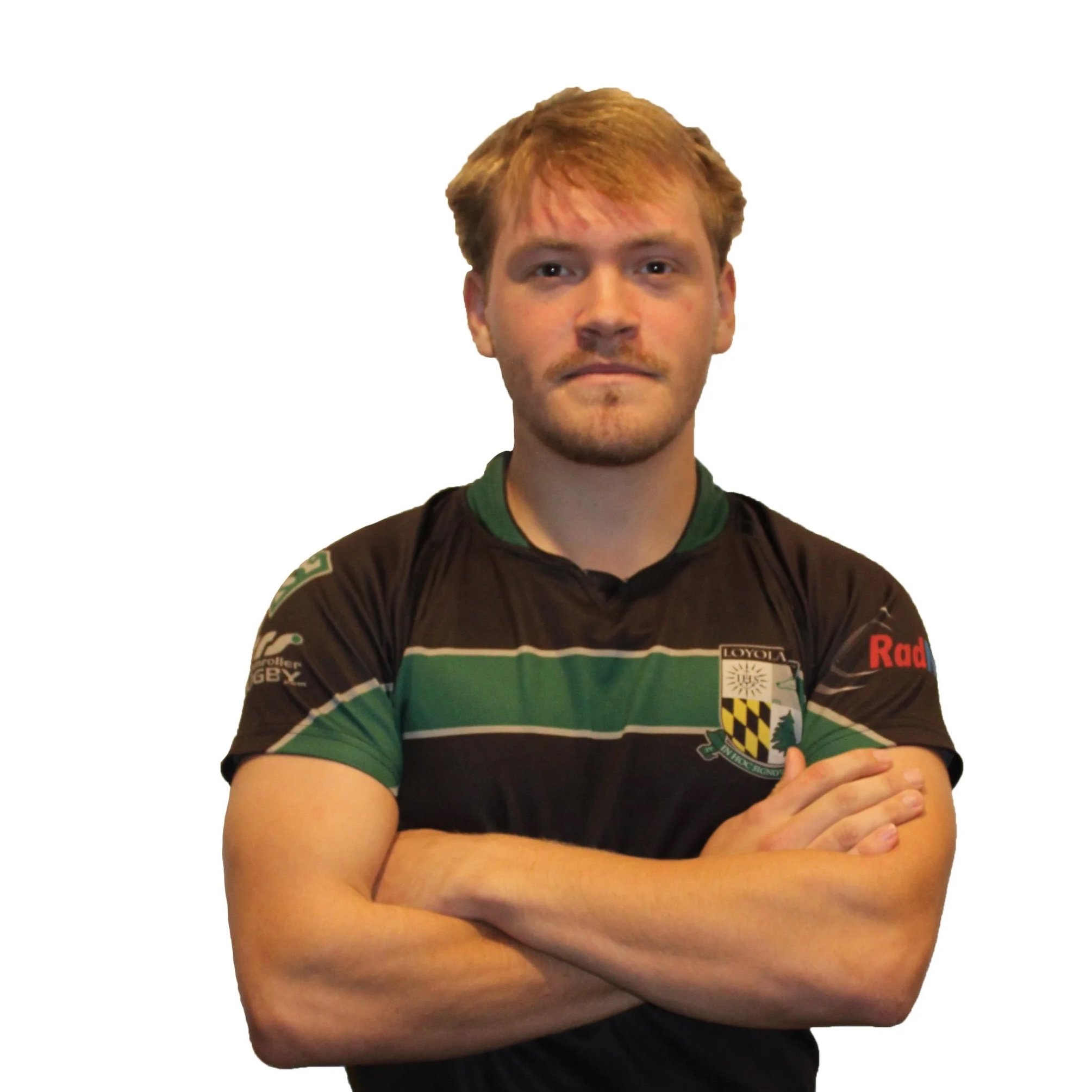 Young man in a rugby jersey against a plain background.