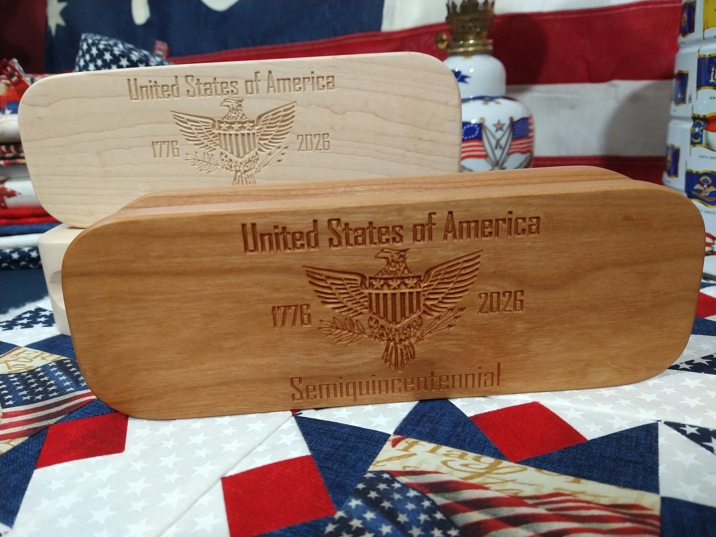 USA 250th anniversary wood clappers in hard maple and cherry. 1776 American flag in back. Red, white, and blue quilt block.