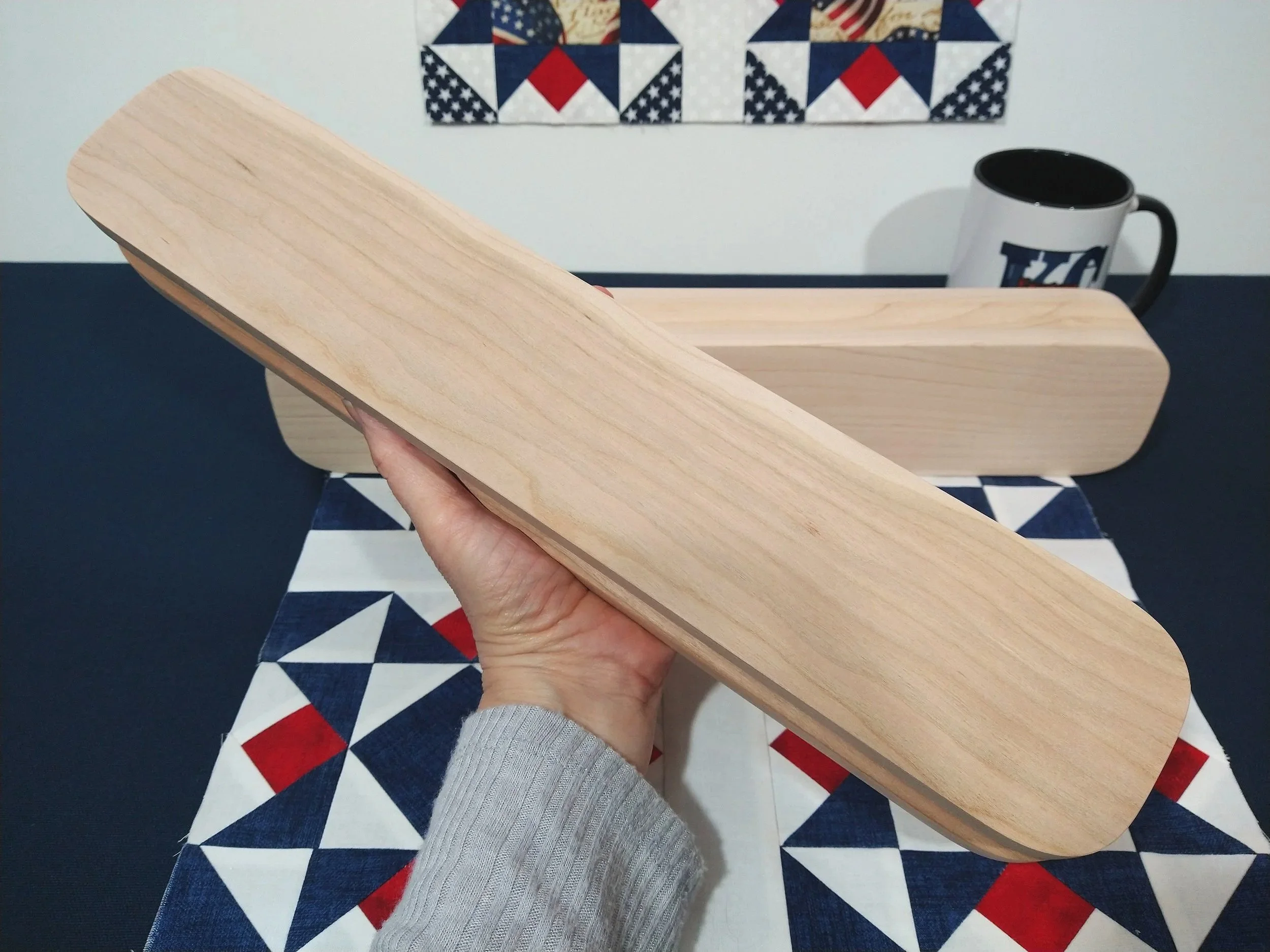 hand holding clapper showing the bottom side