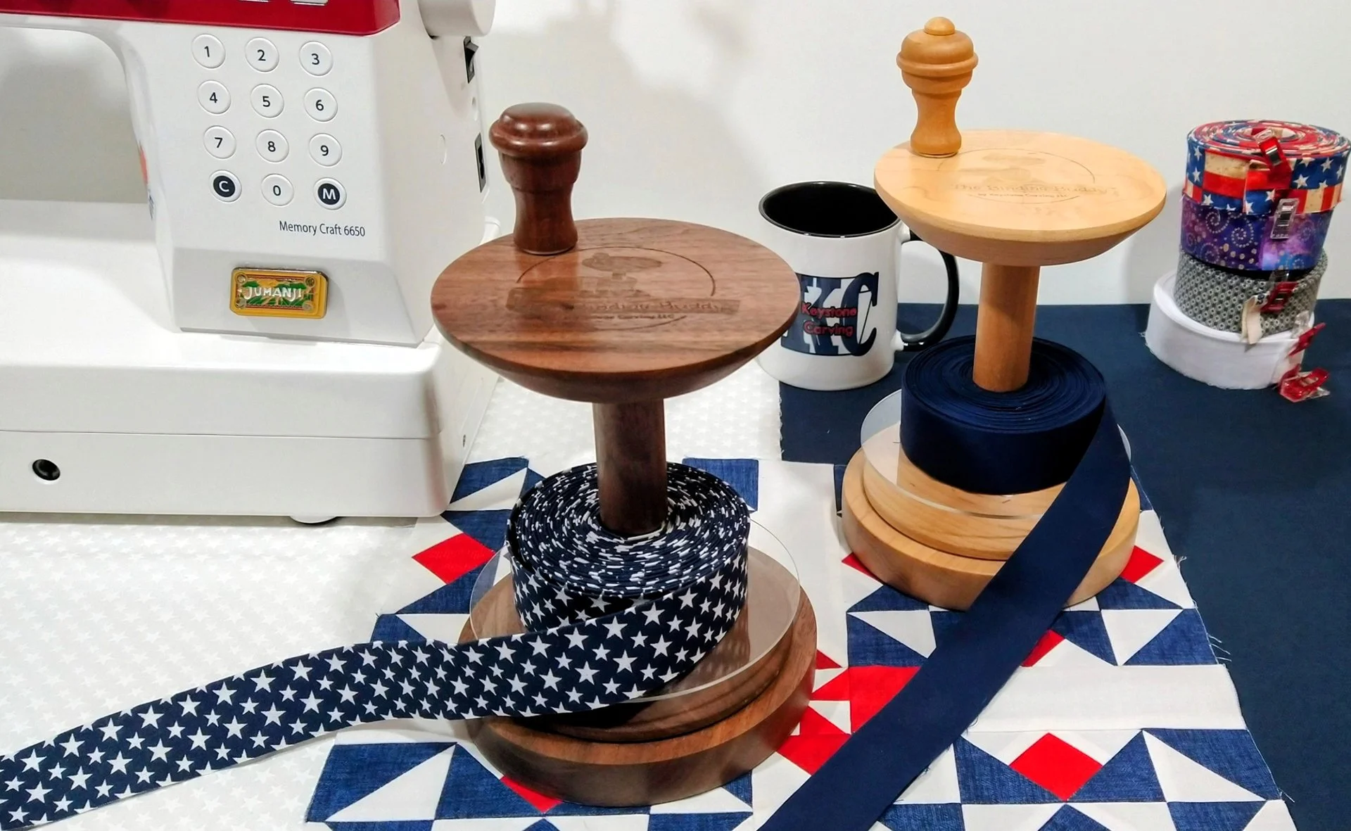 Image display of The best quilt binding tool, the Binding Buddy in walnut and maple on a patriotic quilt block