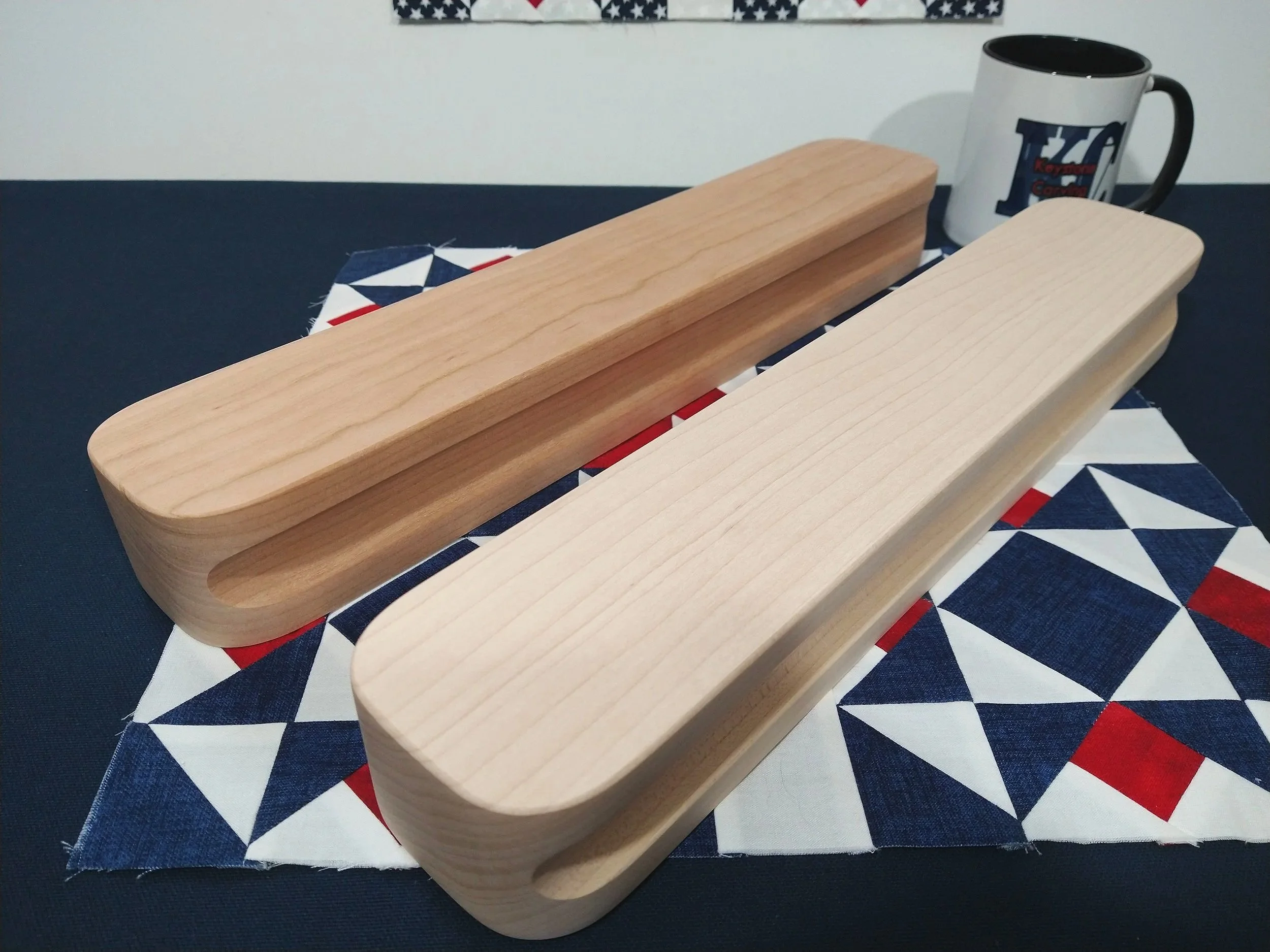 showing keystone carving llc large heavy sixteen inch tailors clapper in maple and cherry on a quilt block