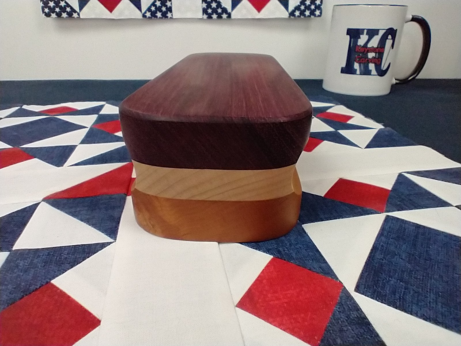 End view of a purple heart, maple, and cherry quilters clapper